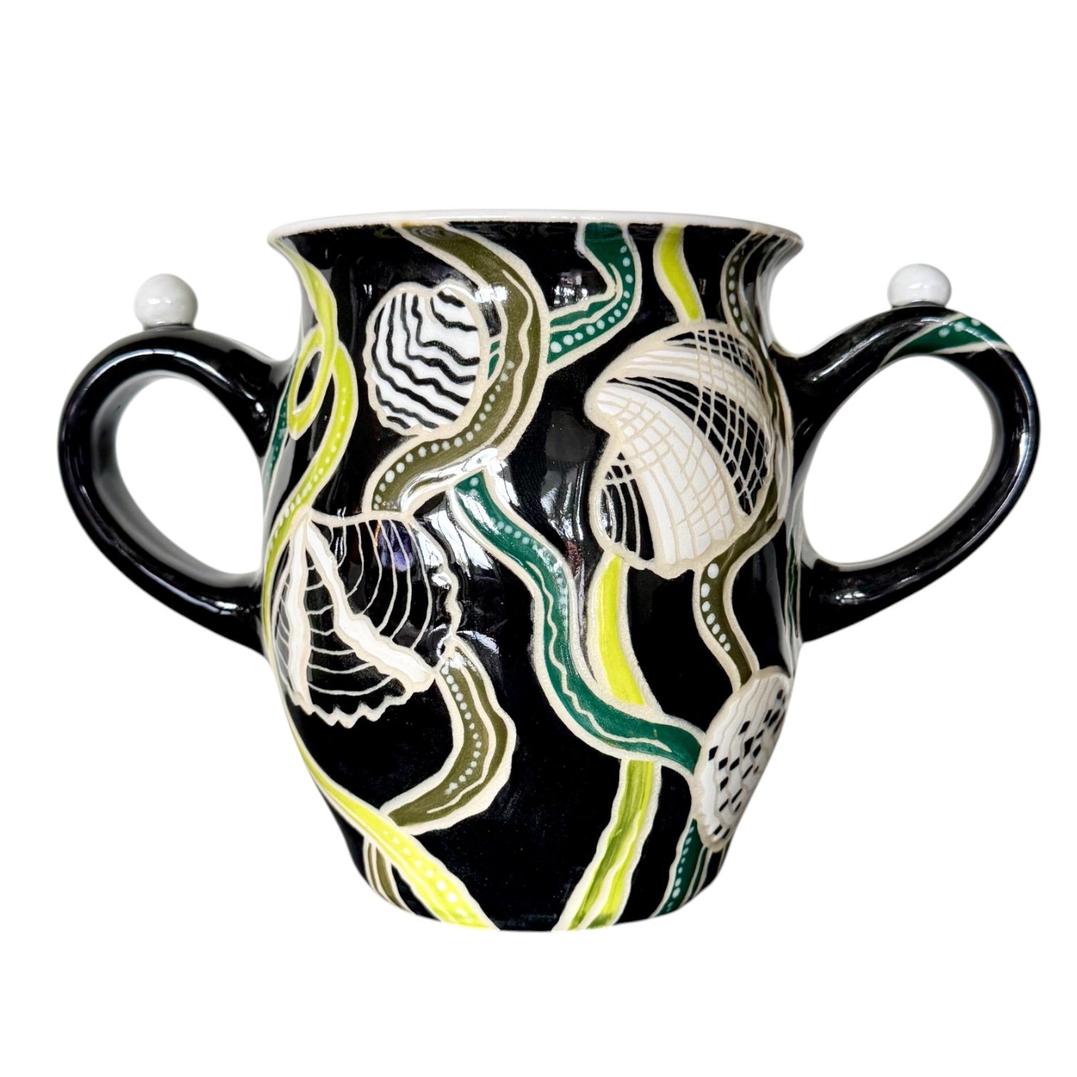 A decorative ceramic cup with a black background and abstract white, yellow, green, and beige patterns, featuring curved handles on either side.