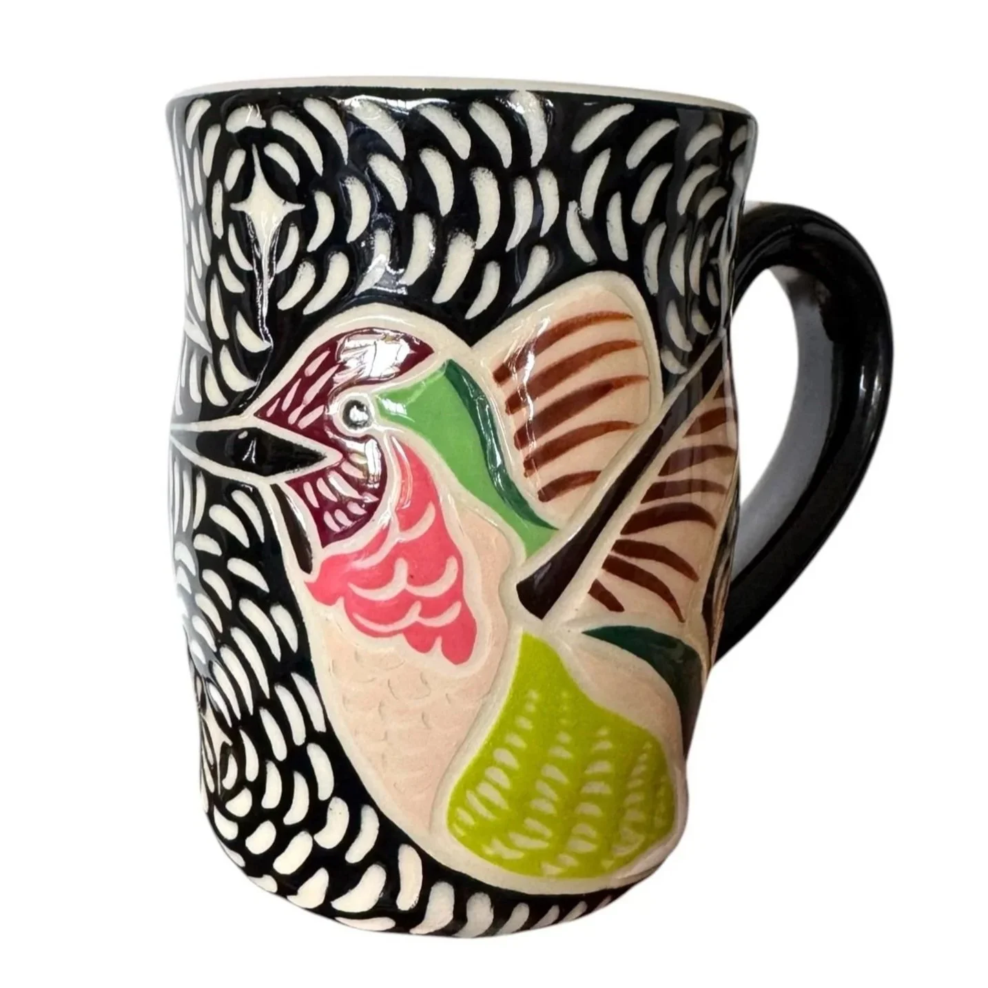 Ceramic mug with colorful and intricate traditional Mexican folk art design, featuring a bird, floral motifs, and vibrant patterns.