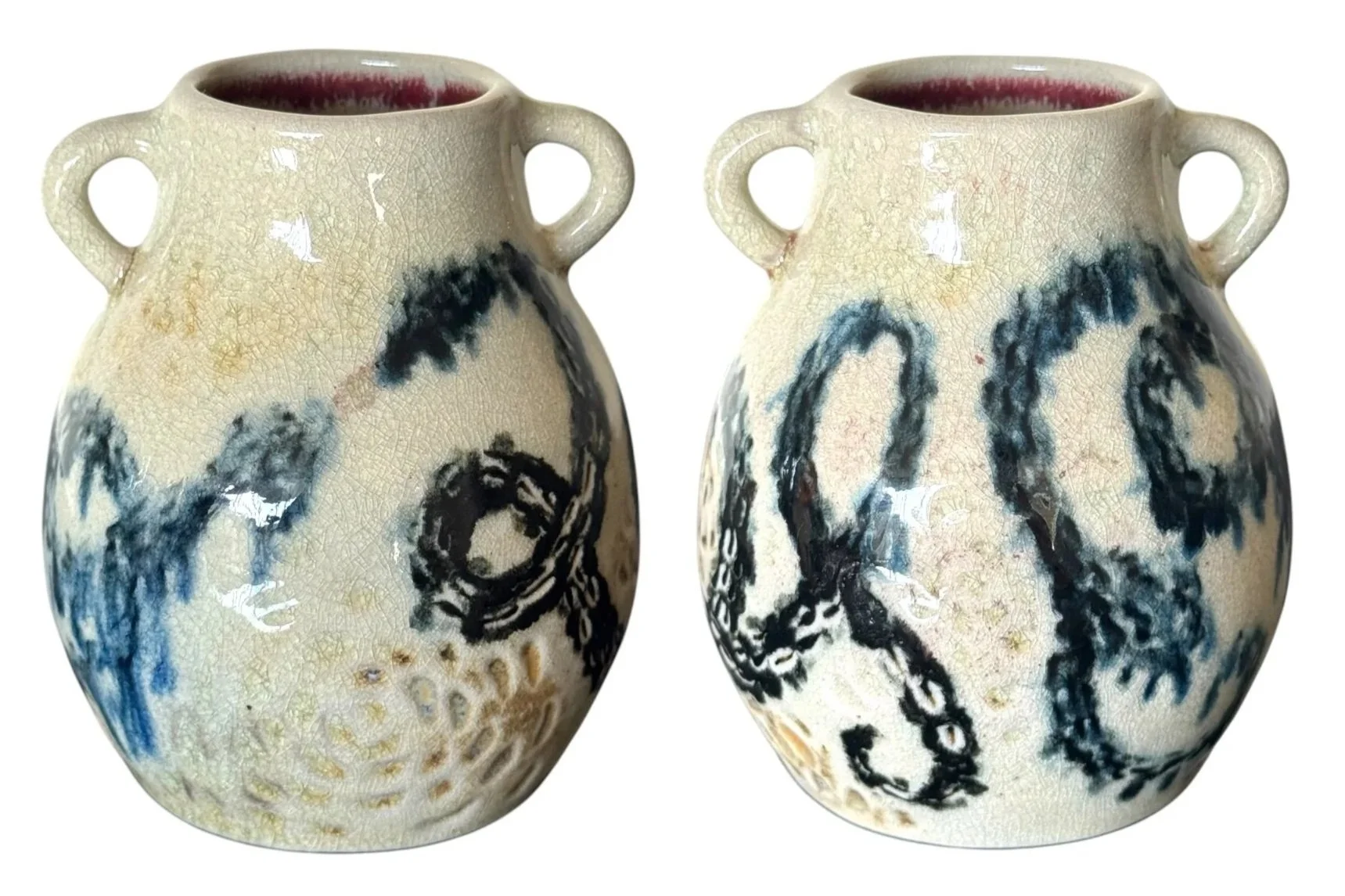 Pair of porcelain vases with off-white crackle glaze, black Chinese calligraphy, and a red interior, set against a white background.