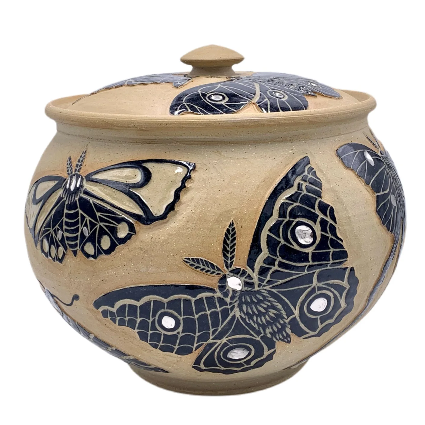 Ceramic jar decorated with blue butterflies and leaves, has a lid with a knob.