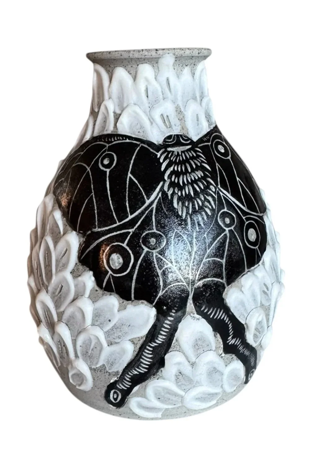Decorative vase with a black and white spider design and white textured patterns resembling leaves or petals.