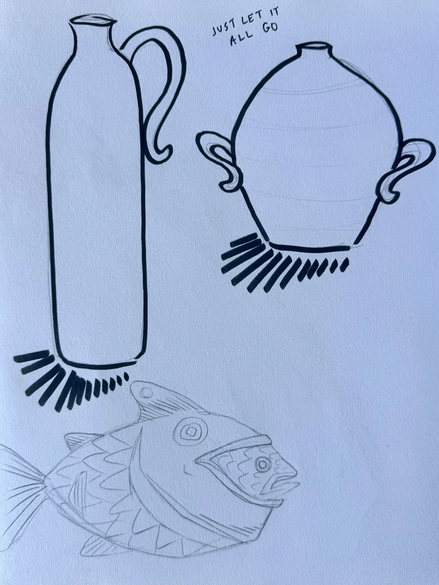 A sketch of a glass bottle and a teapot, with the phrase "Just let it all go" written above them. Additional sketches of a fish and a butterfly are faintly visible below.