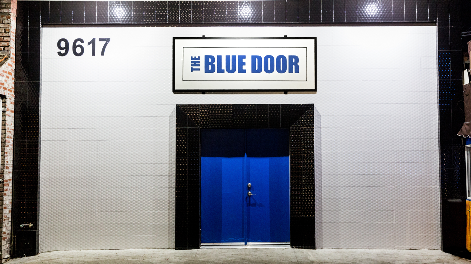 The Blue Door Theatre's front facade featuring it's iconic Blue Door