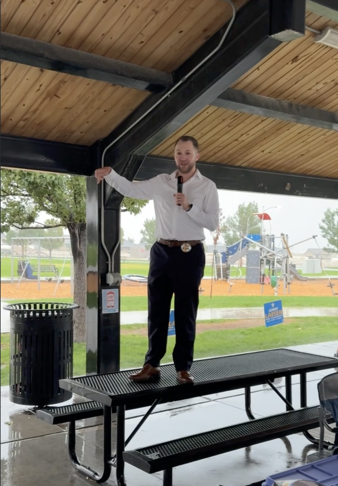 Brett Nielsen speaking at a community event in Saratoga Springs, Utah