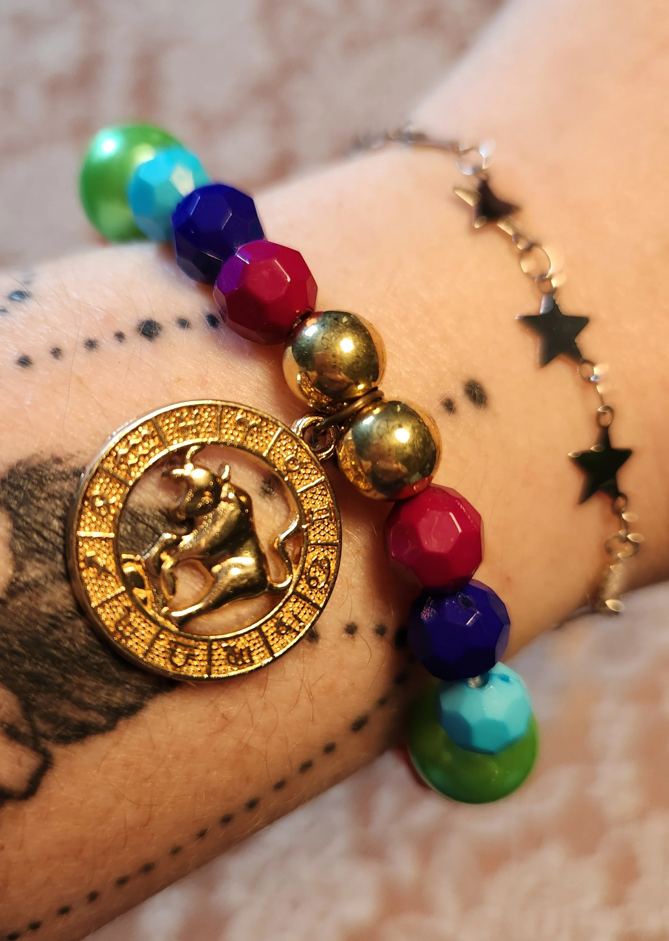 pride_zodiac_medal_gold_wrist1.jpg