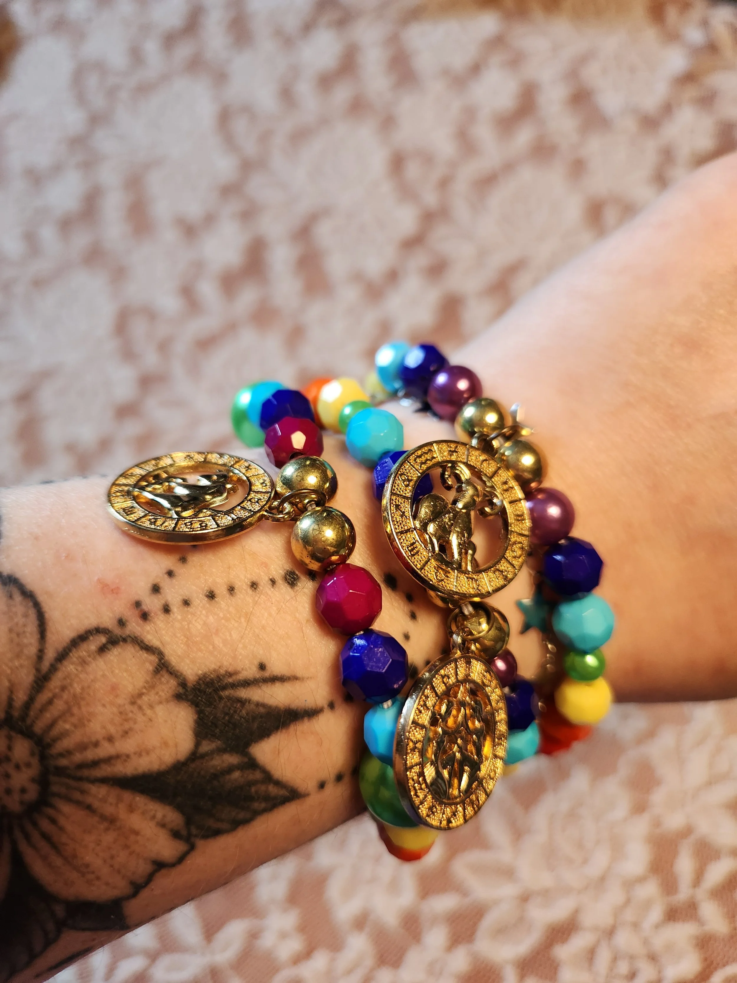 pride_zodiac_medal_gold_wrist2.jpg