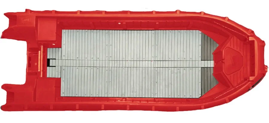 Top view of a red toy boat with a silver deck and a small cabin at the front.