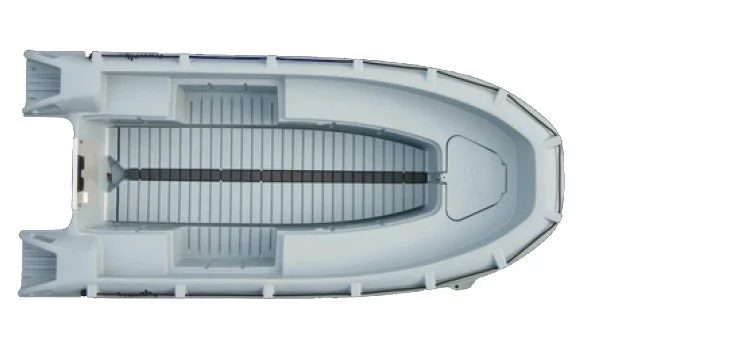 Top-down view of a small white boat with an interior in gray, showing seating and a central steering console.
