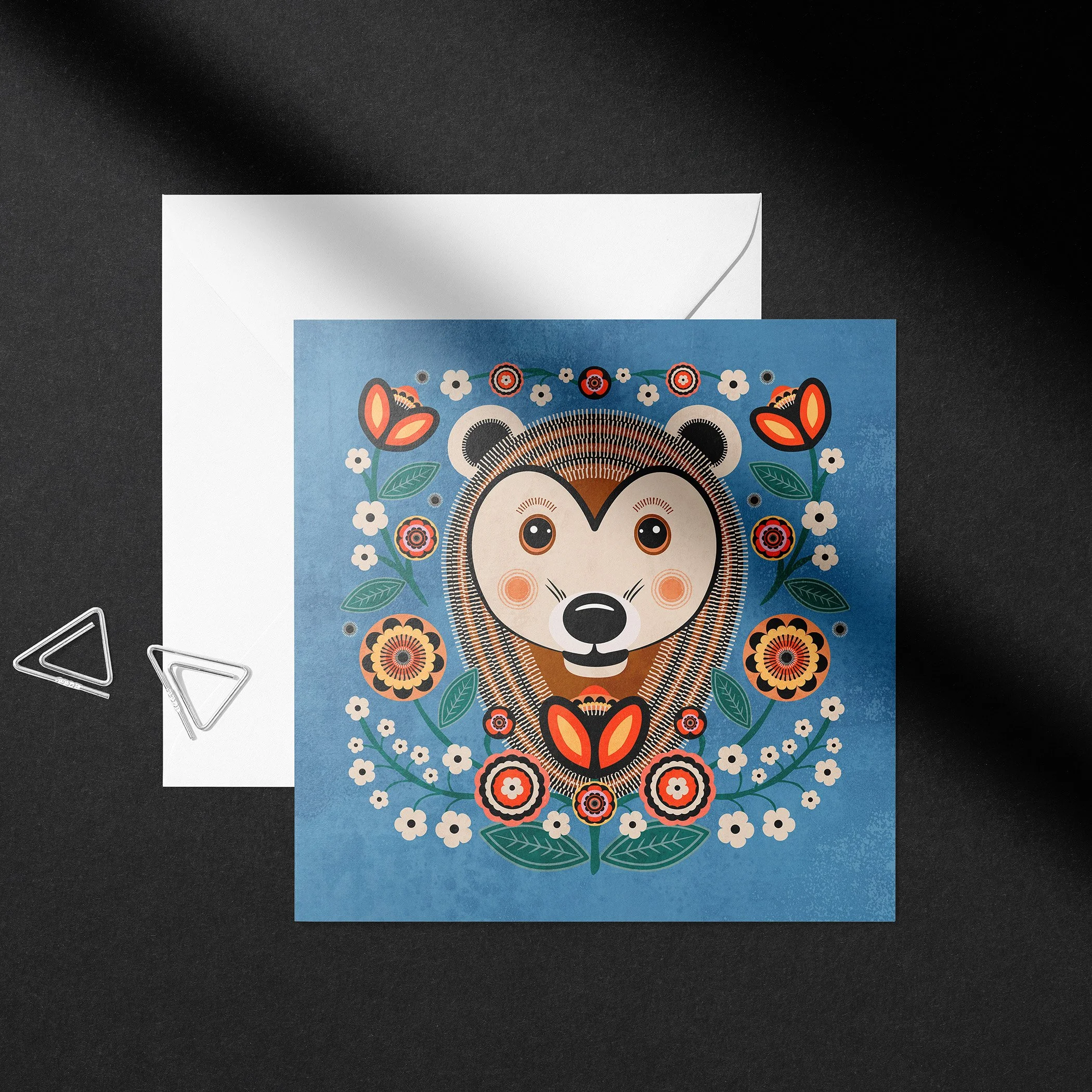 Hedgehog-themed floral folk art greeting card with blank envelope from whimsical animal card collection.