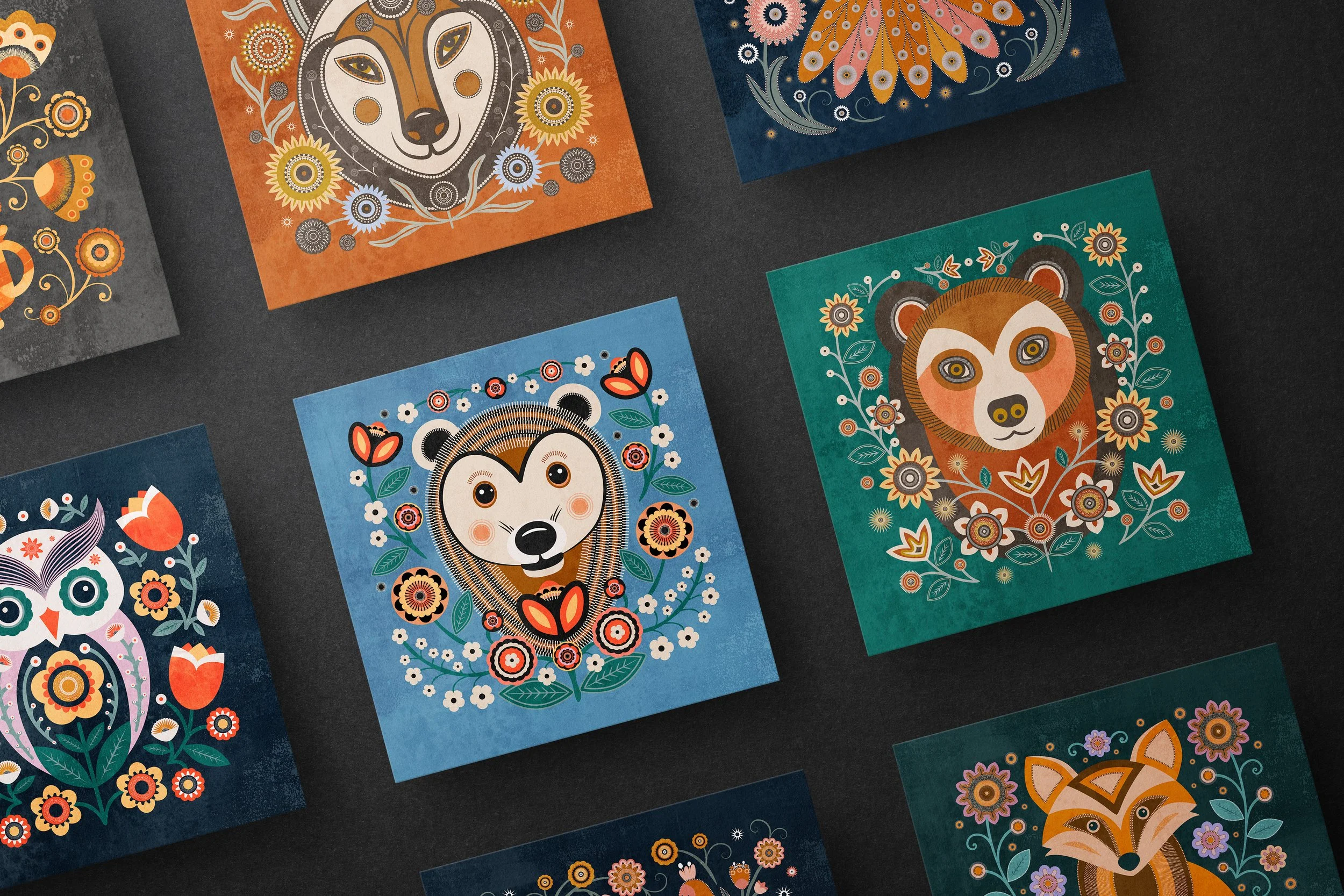 Whimsical animal greeting card set featuring floral folk art illustrations in rich colors and decorative detail.