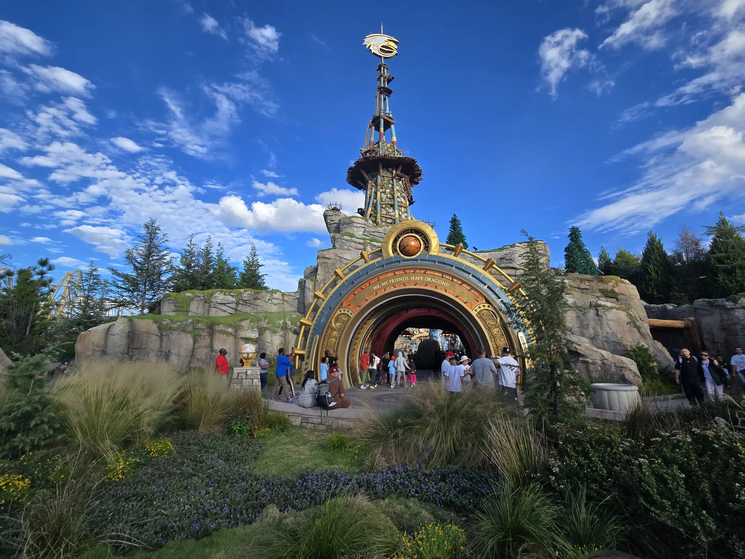 How To Train Your Dragon:   Walk through a faux rock Themed Portal and step into the Isle of Berk.  Structural design for rockwork, themed tower and the theming in the cave on the right side.   See picture #4 for details.  
