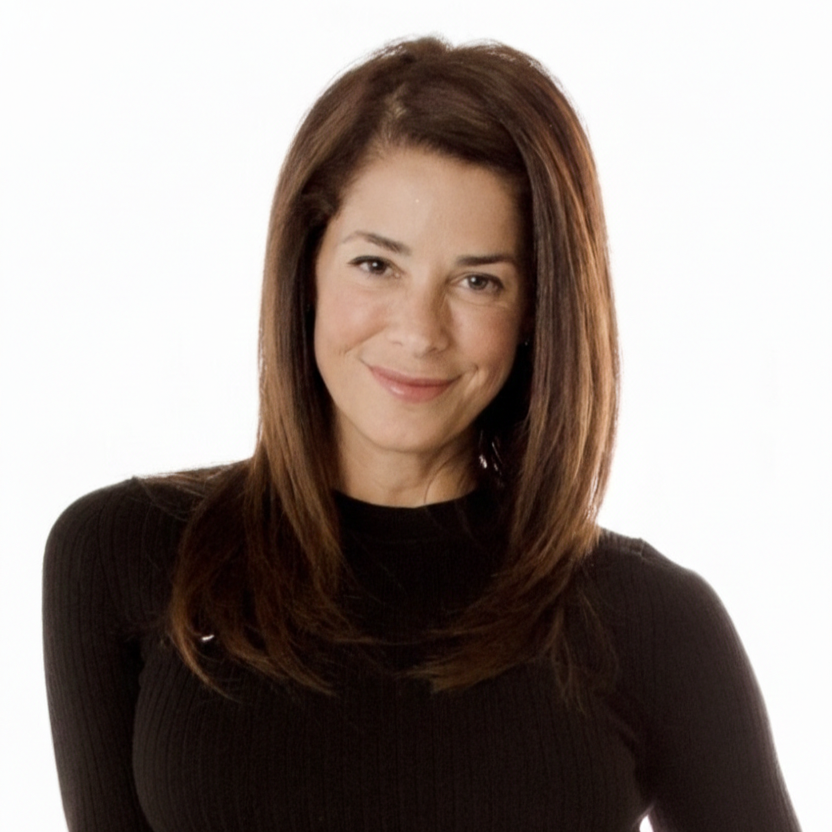 Portrait of a woman with shoulder-length brown hair, wearing a black top, smiling against a white background.