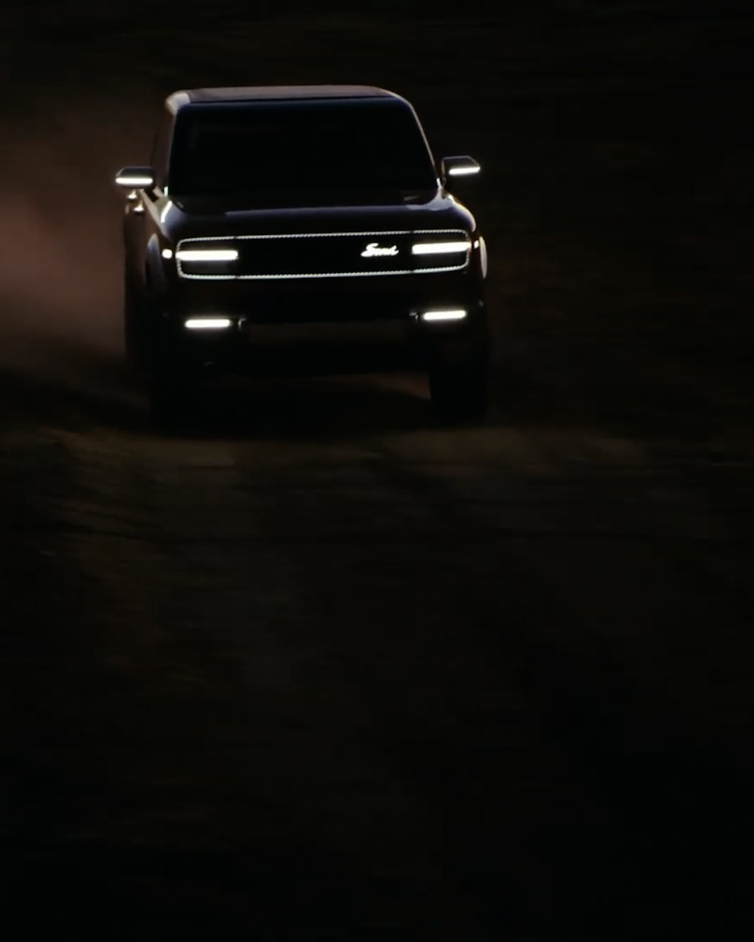 CUT TO: Mysterious Traveler racing down a dark dirt road towards camera