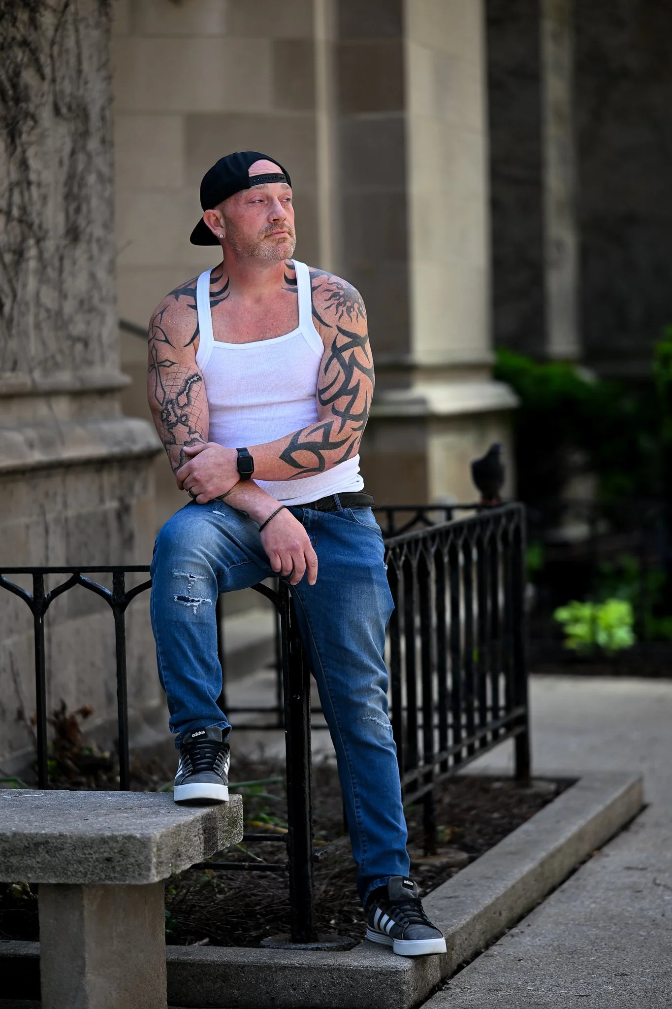 Male on iron railing in Chicago 