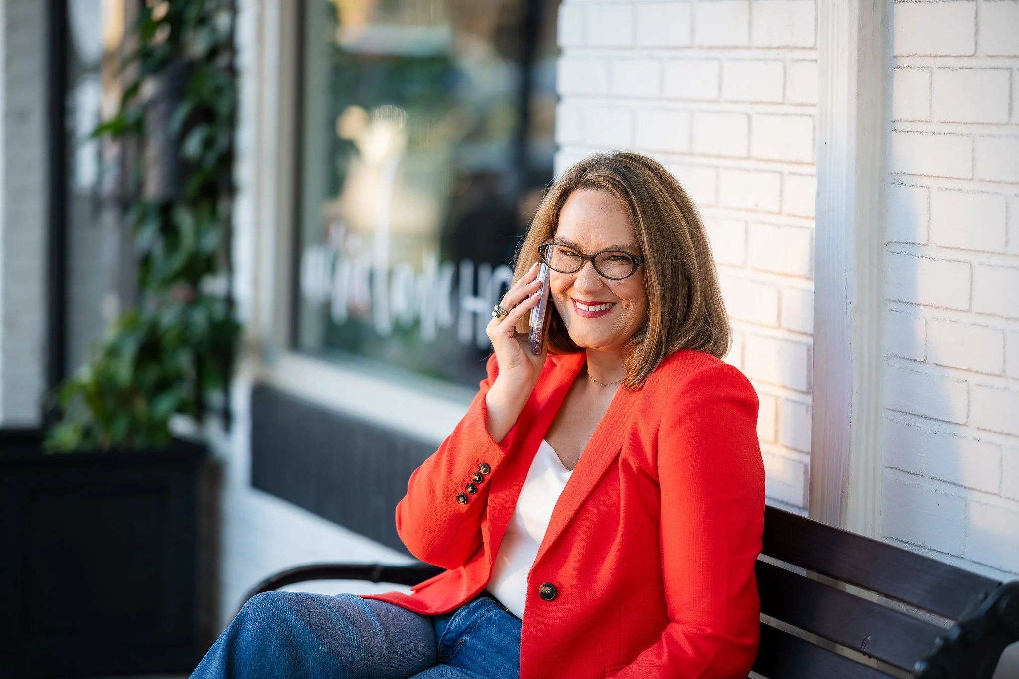 Professional woman during lifestyle headshot session at local home goods store, on the phone, in Safety Harbor, FL