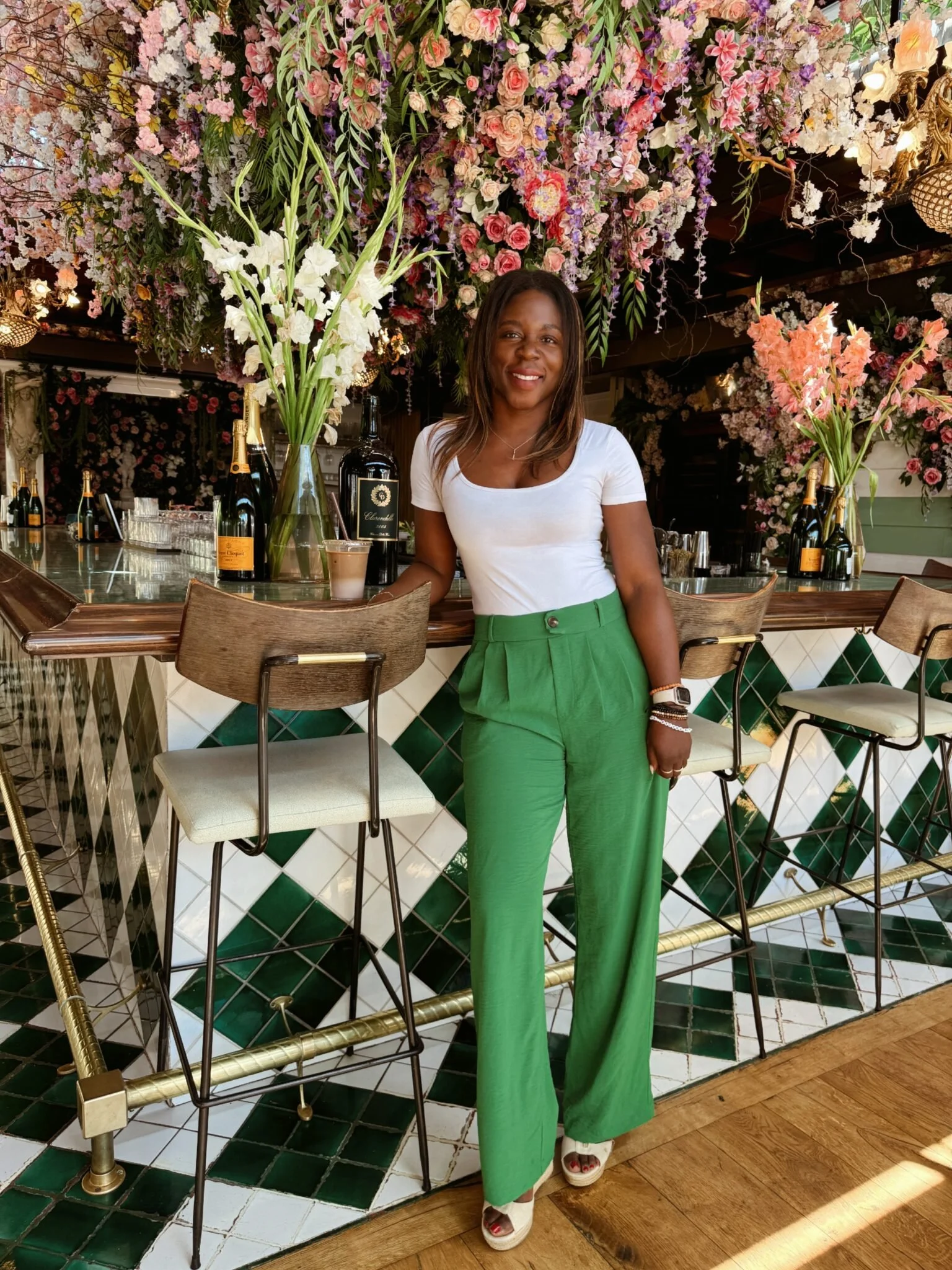 girl in green pants in a west hollywood restaurant with gorgeous colors and branding color psychology and how colors can represent your brand
