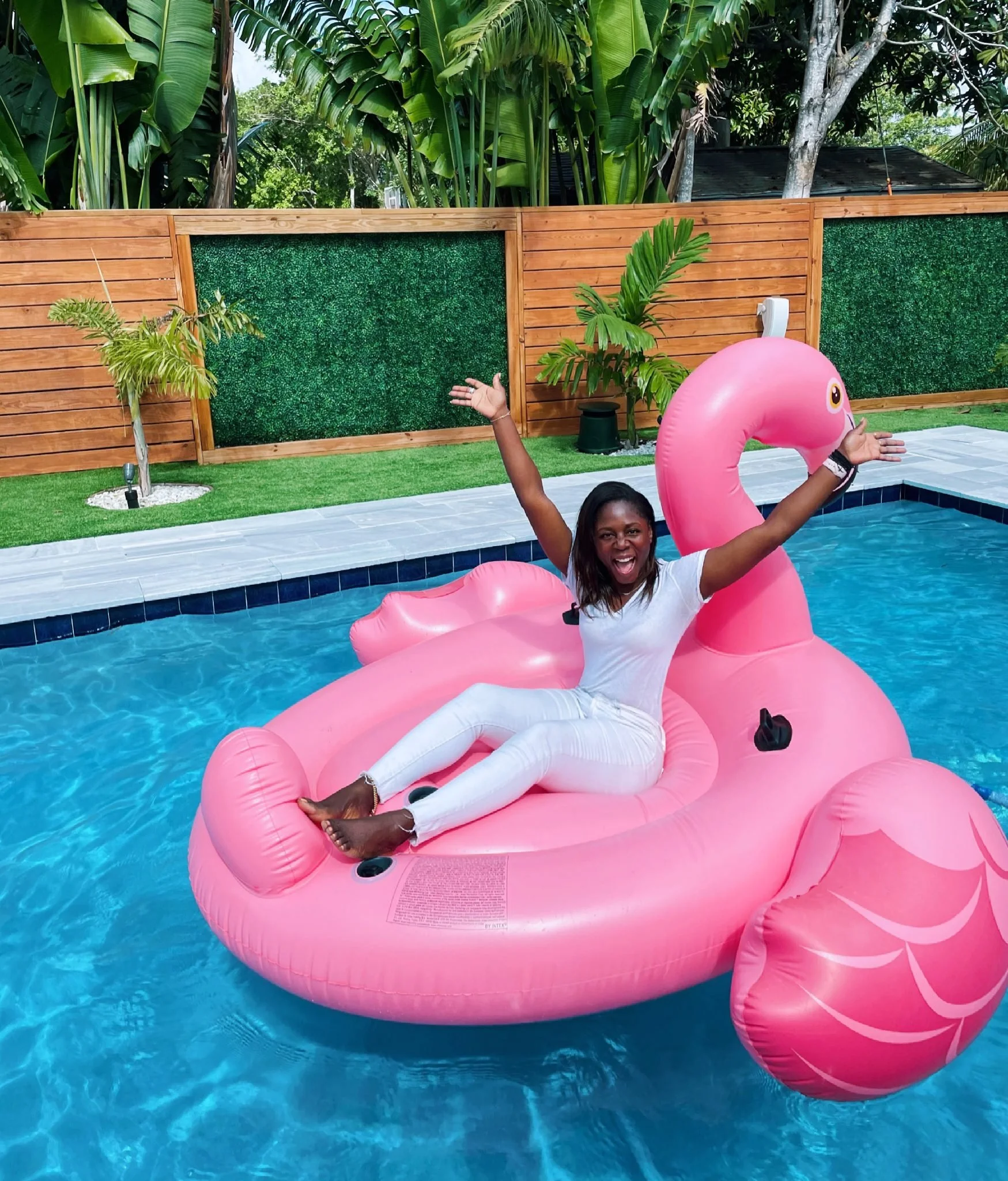 personal brand lifestyle shoot in a pool on a pink flamingo float in South Florida and how to create your own personal brand