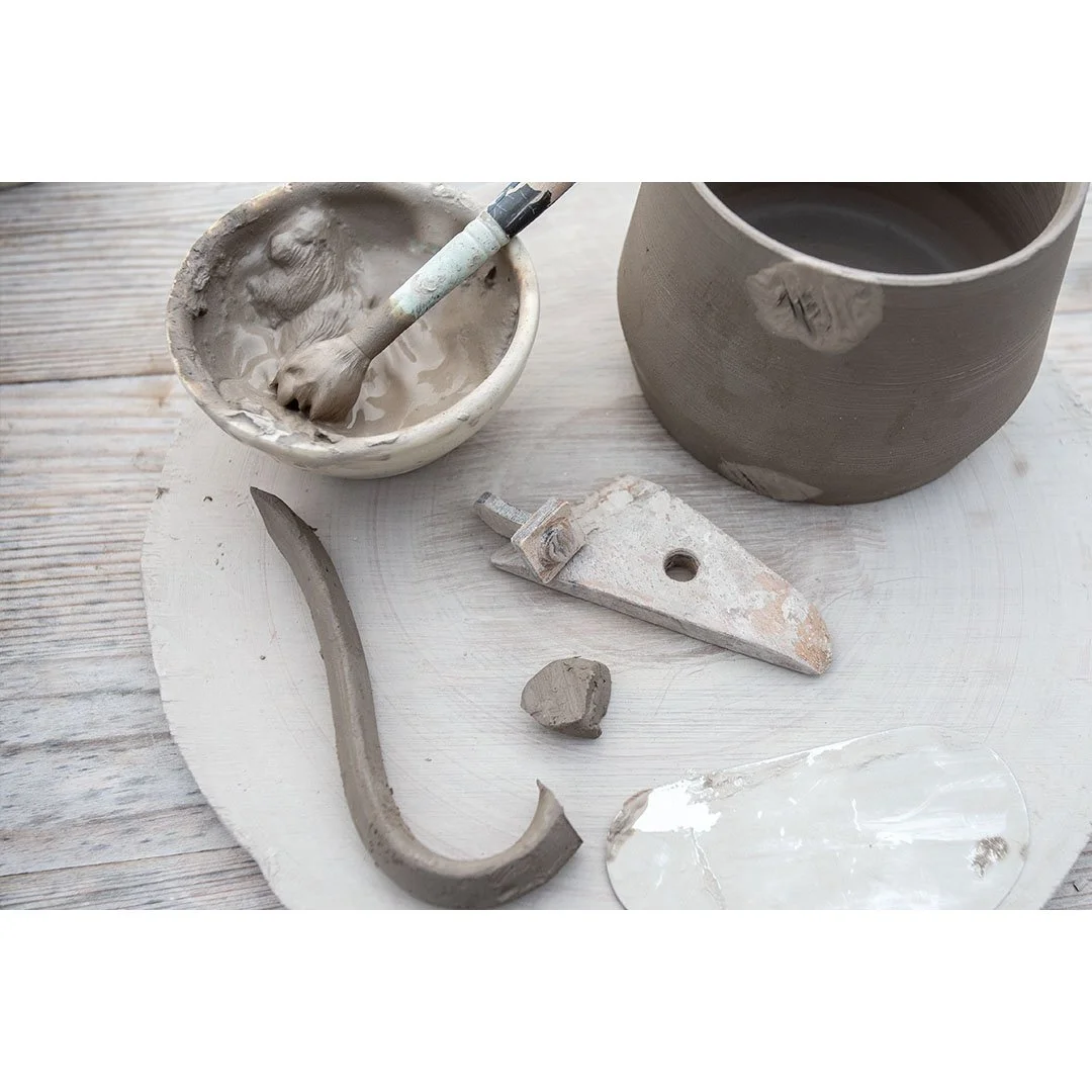 L - Adding handles with clay slip.jpg