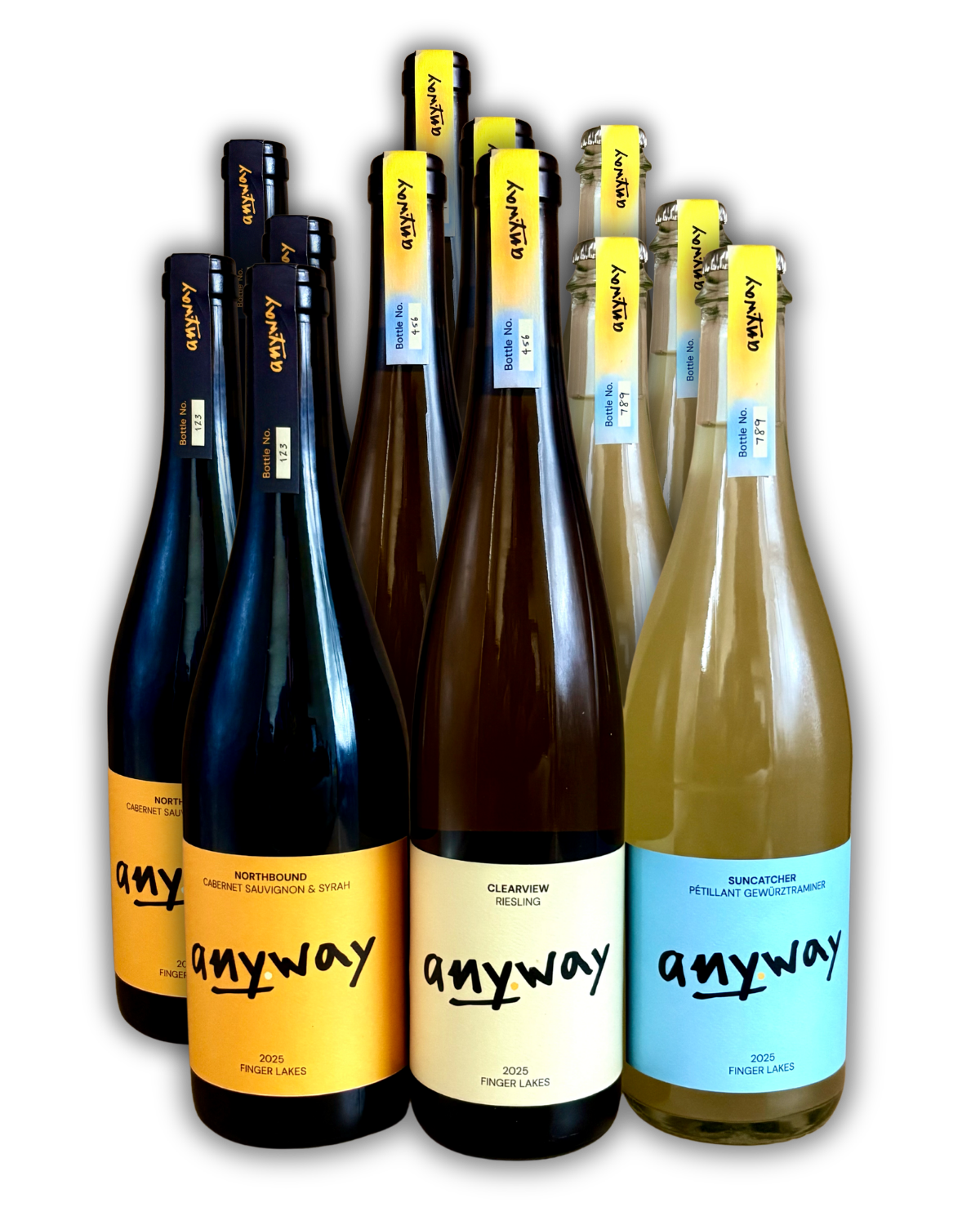 Twelve bottles of Anyway Wine's 2025 vintage featuring different labels and colors. From left to right, 4 bottles of each: a red wine blend called Northbound, a Riesling called Clearview, and a sparkling Gewüztraminer called Suncatcher.