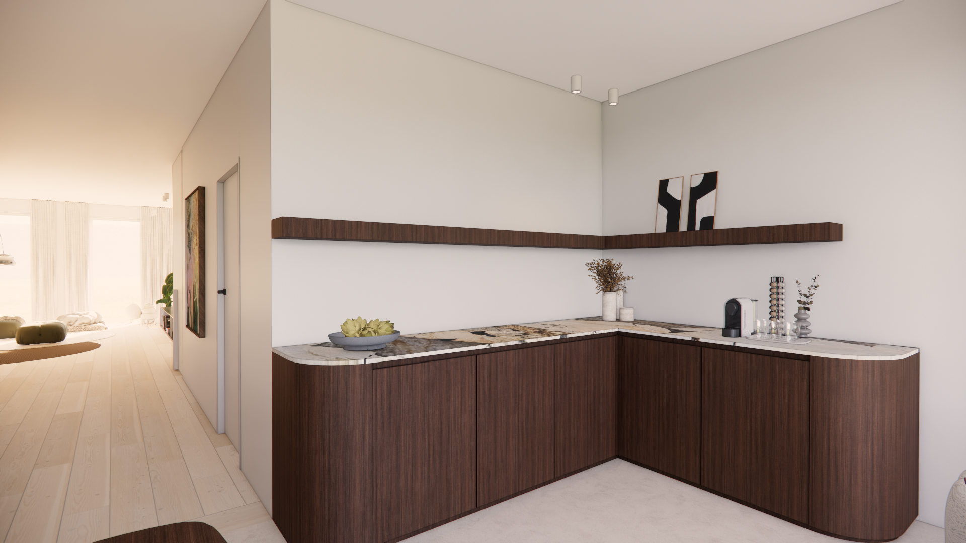 Modern kitchen with dark wood cabinets, marble countertop, white walls, and minimal decor, with a view into a bright living area.