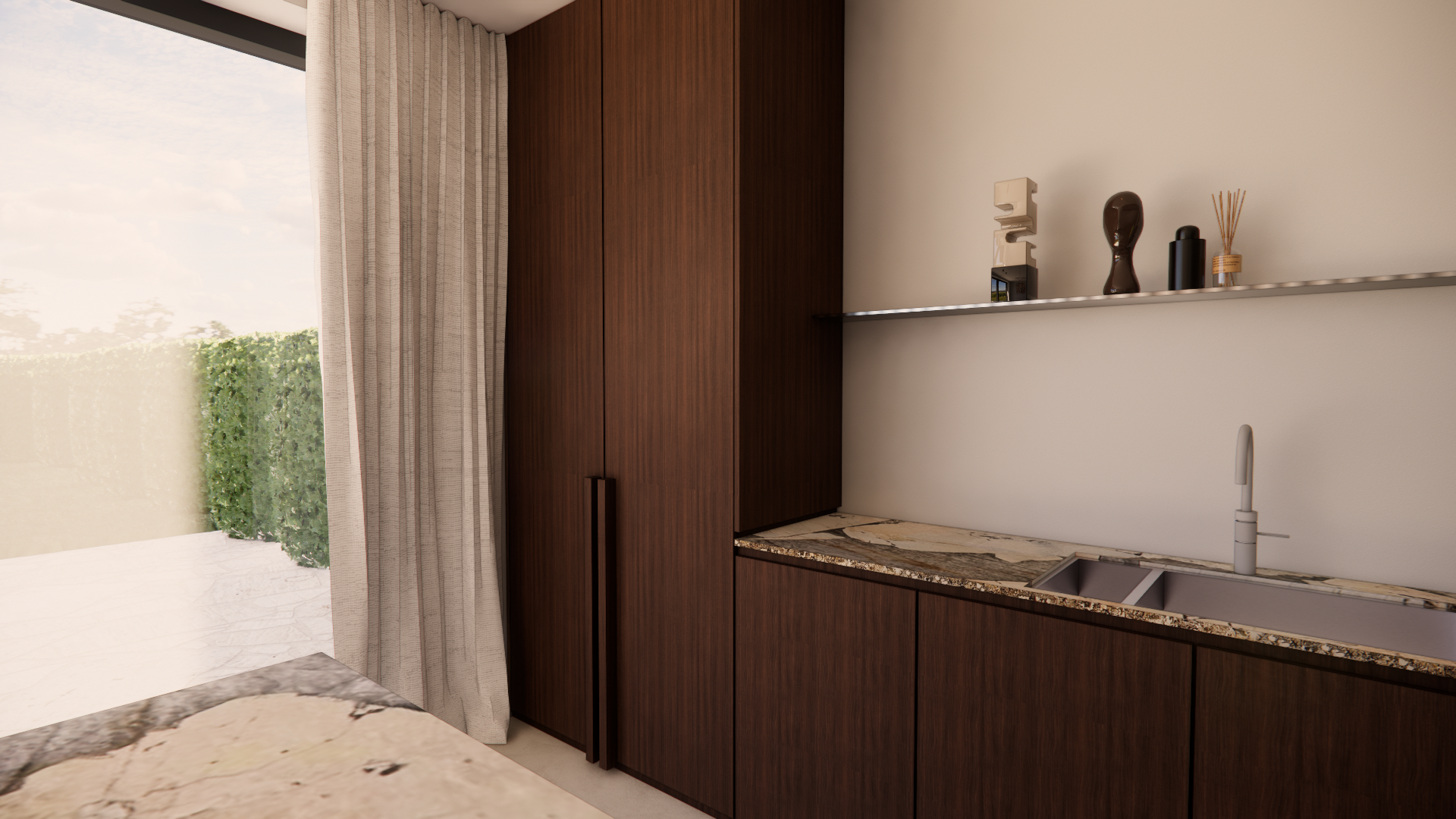 A modern kitchen with dark wood cabinets, a marble countertop, and a stainless steel sink with a white faucet. A glass door with gray curtains opens to a patio with greenery outside. A metal shelf above the countertop holds decorative items, includin