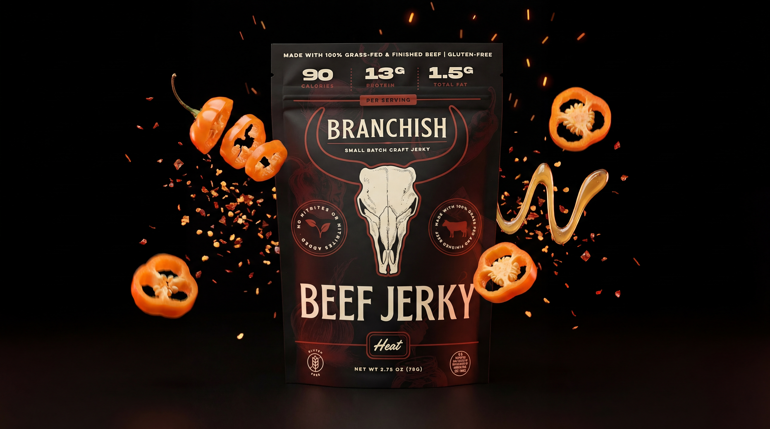 Package of Branchish small batch craft beef jerky with slices of orange bell peppers and a swirl of sauce around it, set against a dark background with floating pepper slices and chili flakes.