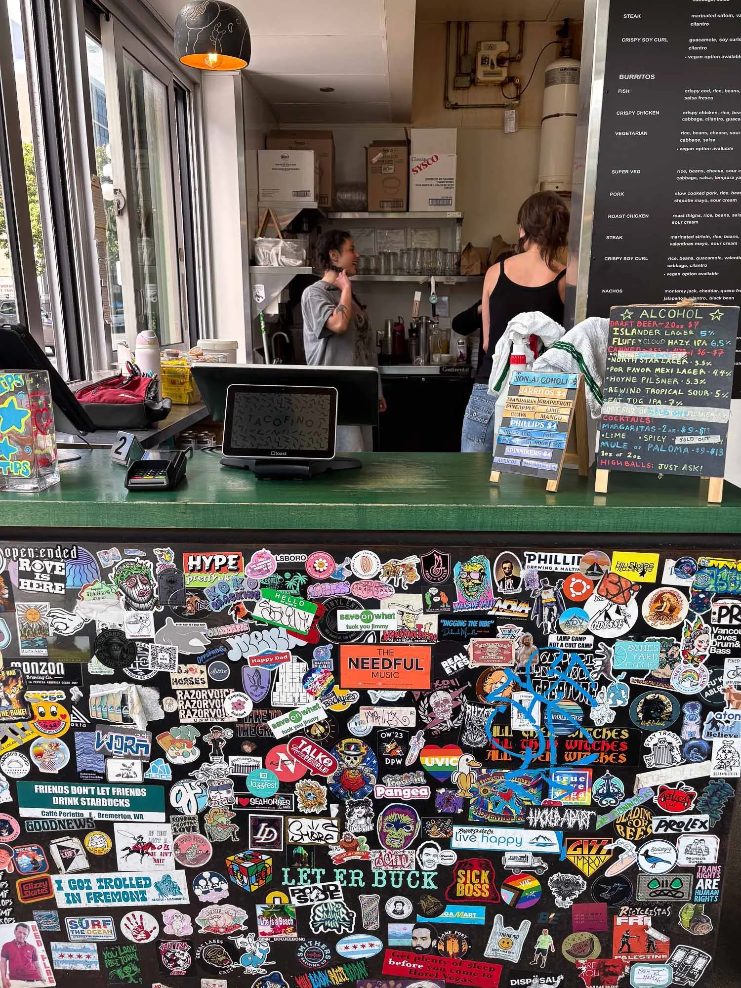 the-neeful-music-sticker-orange-at-cafe-window.jpg