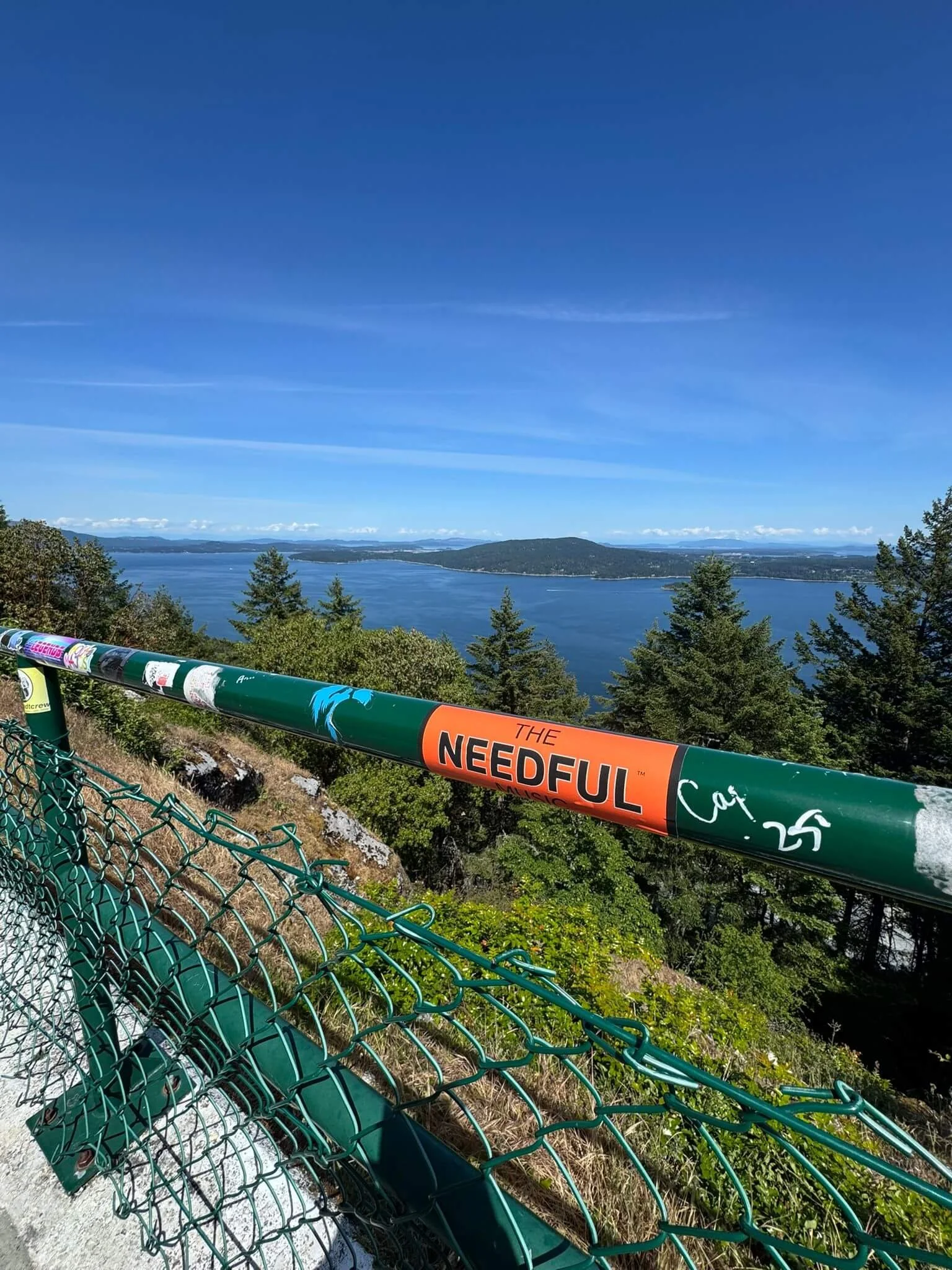 orange-needful-sticker-on-railing.jpeg