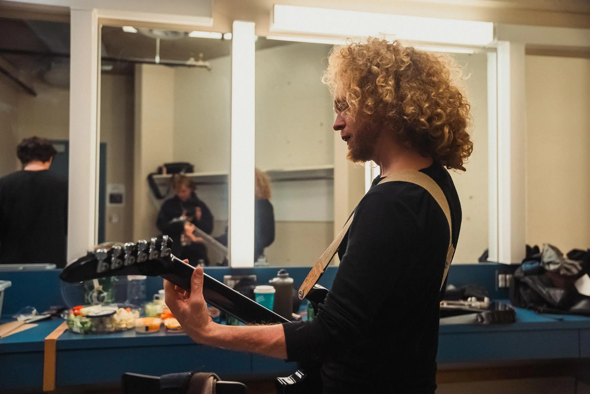 Glenn of The Needful practicing backstage at the Trooper show in Duncan, BC