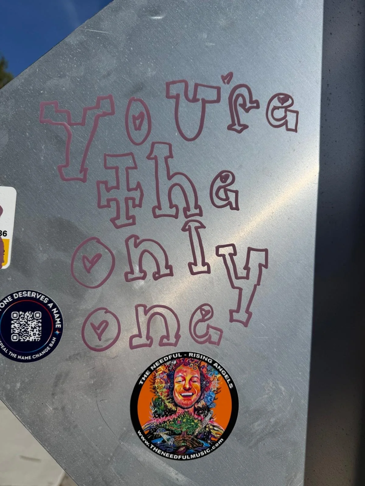A Needful Rising Angels sticker found on Vancouver Island during the tour of the Needful in 2026