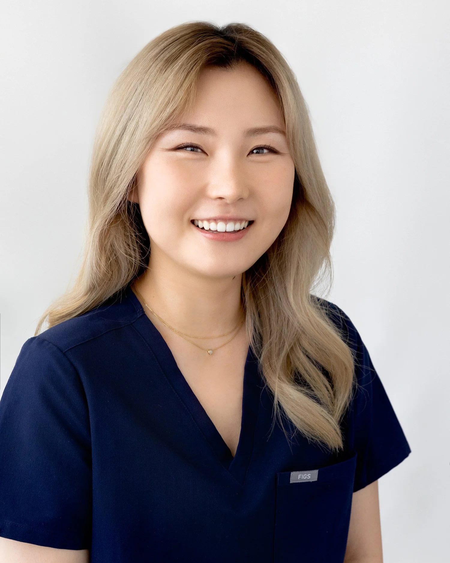 Approachable medical professional portrait of a woman laughing naturally in San Marino CA