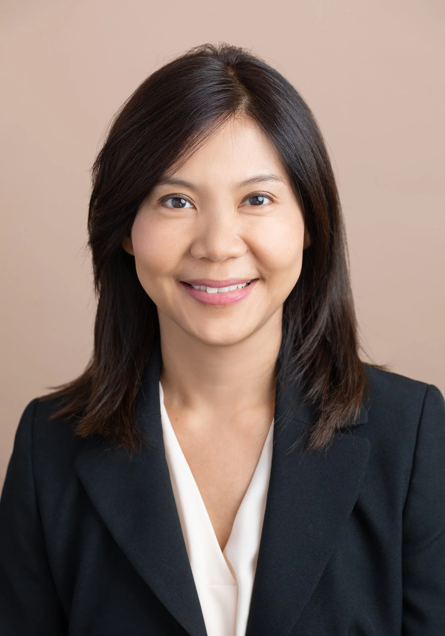 Professional headshot of a woman with a confident smile at Shinkfield Studio in San Marino CA