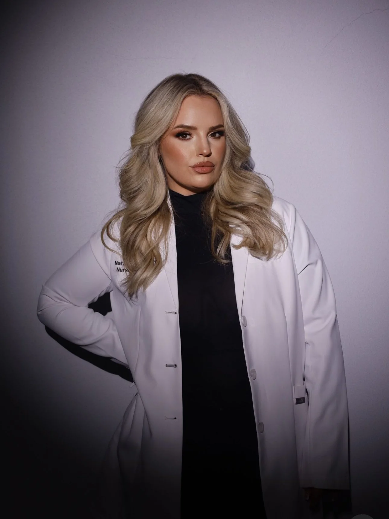 Blonde nurse in white coat injector botox filler weight loss makeup facial