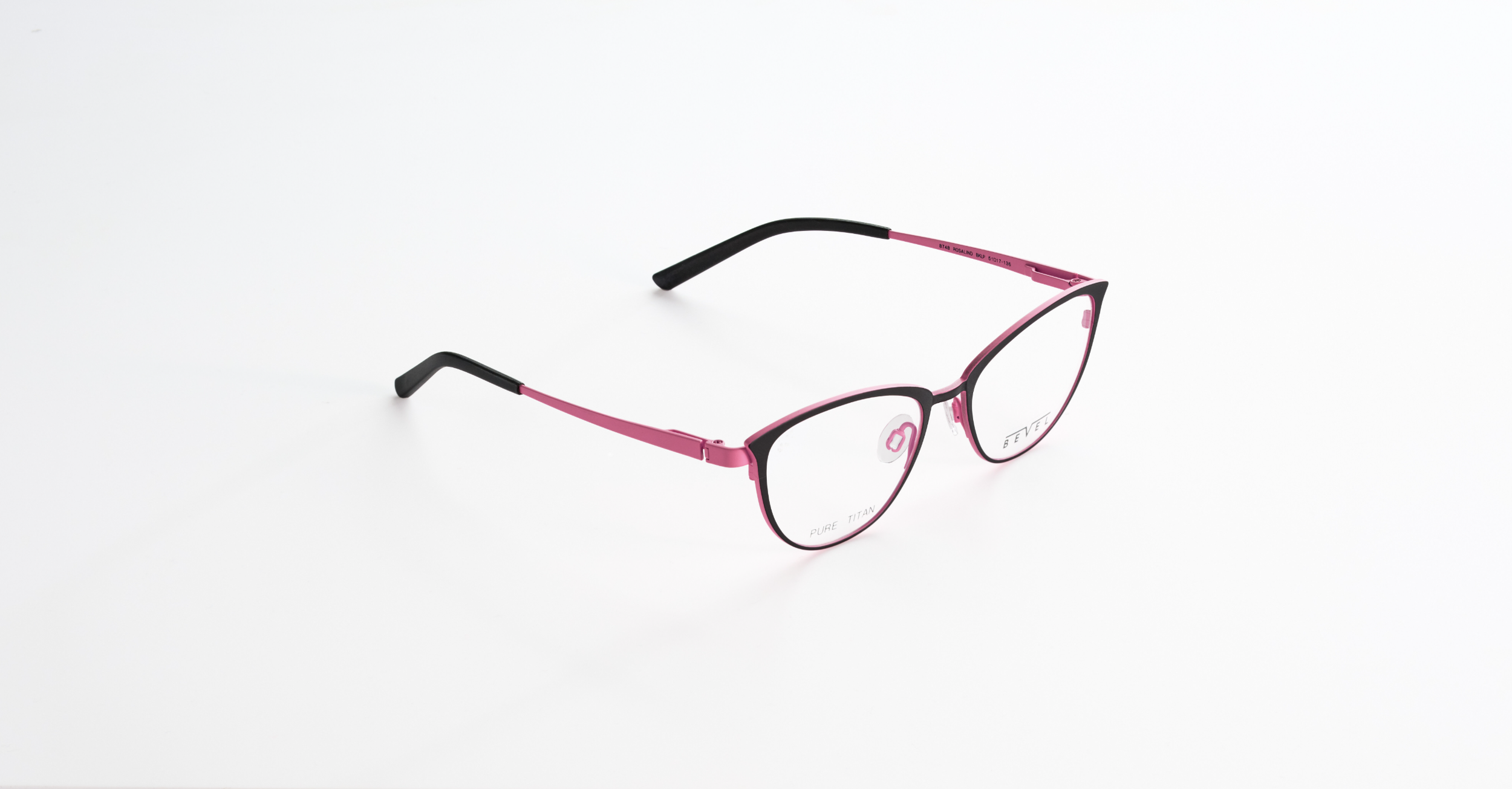 A pair of pink and black Bevel eyeglasses with clear lenses on a white surface.