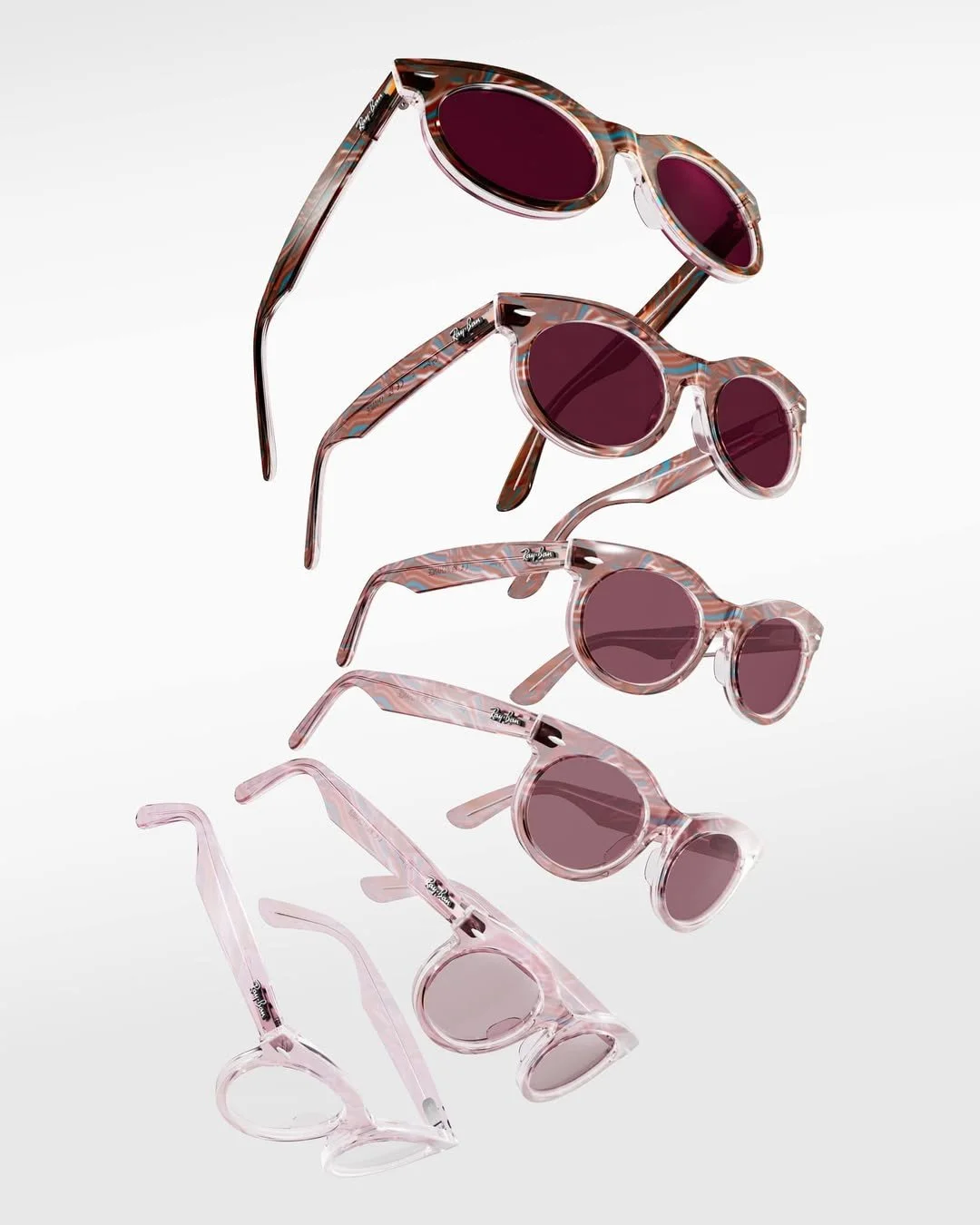 A collection of five pairs of sunglasses with pink and tortoise shell frames and dark lenses, arranged in a descending diagonal line against a white background.