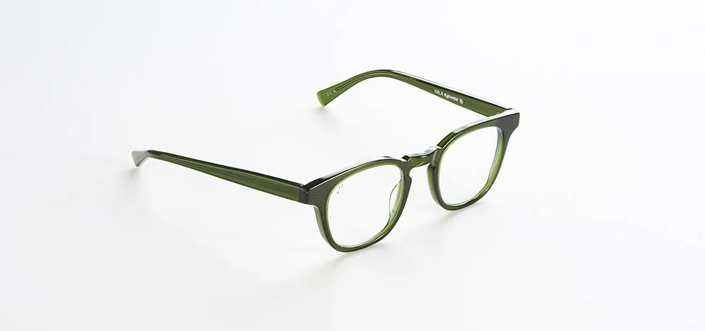 A pair of green Kala Eyewear eyeglasses with clear lenses on a white background.