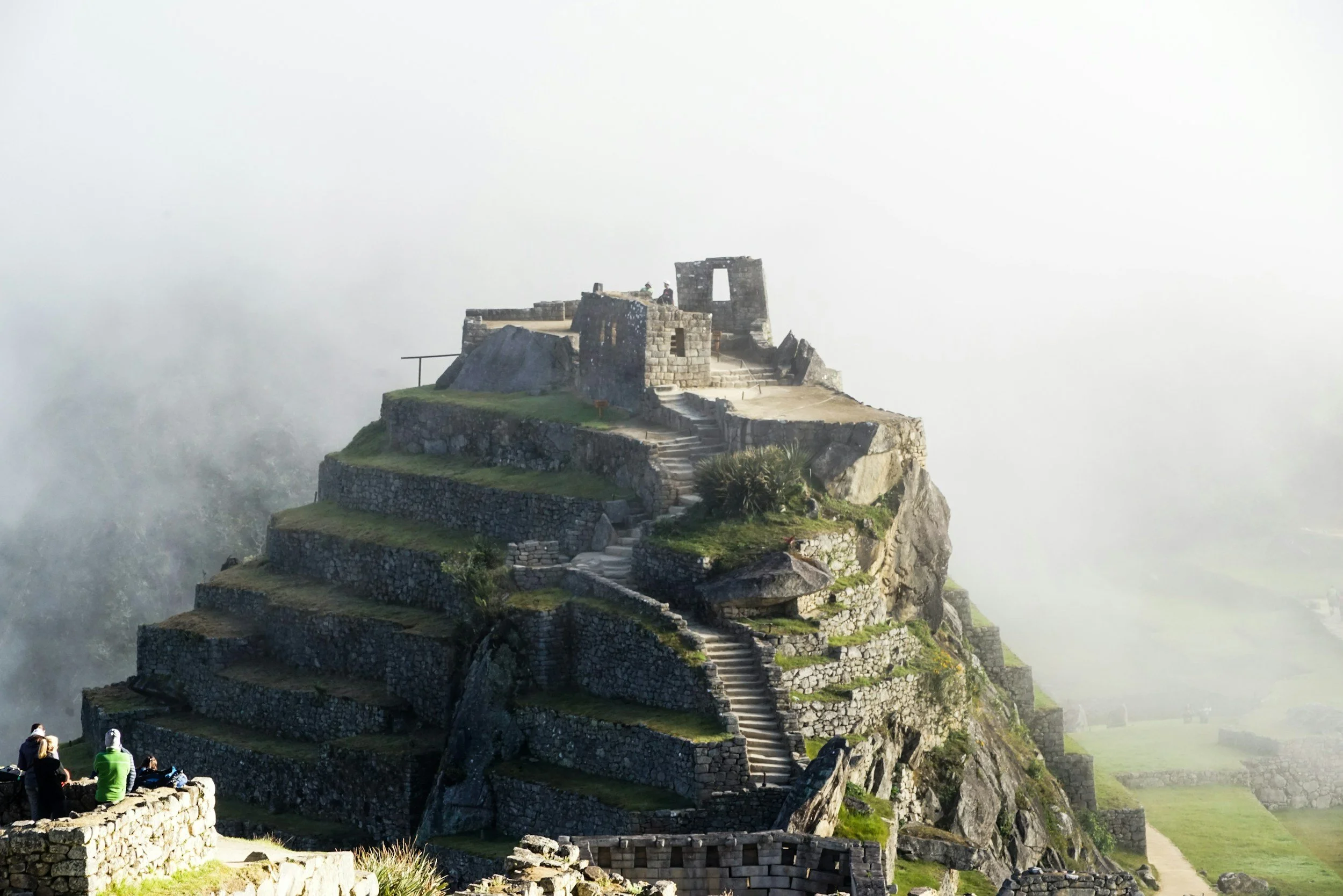 ruins on a hill shrouded in fog