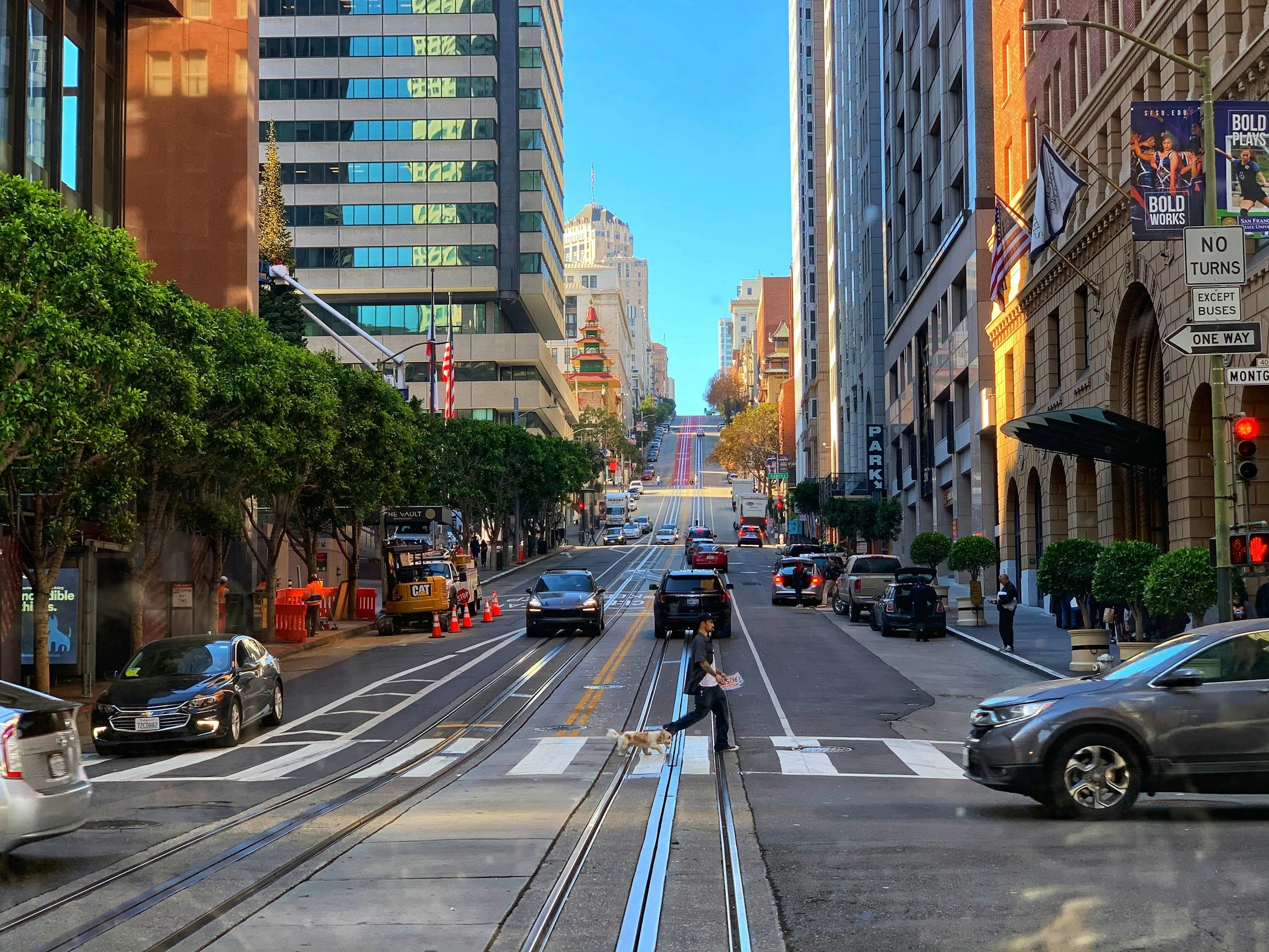 person crossing the street in a busy city