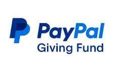 Scenic landscape of a lake surrounded by rolling hills and towering mountains under cloudy sky.