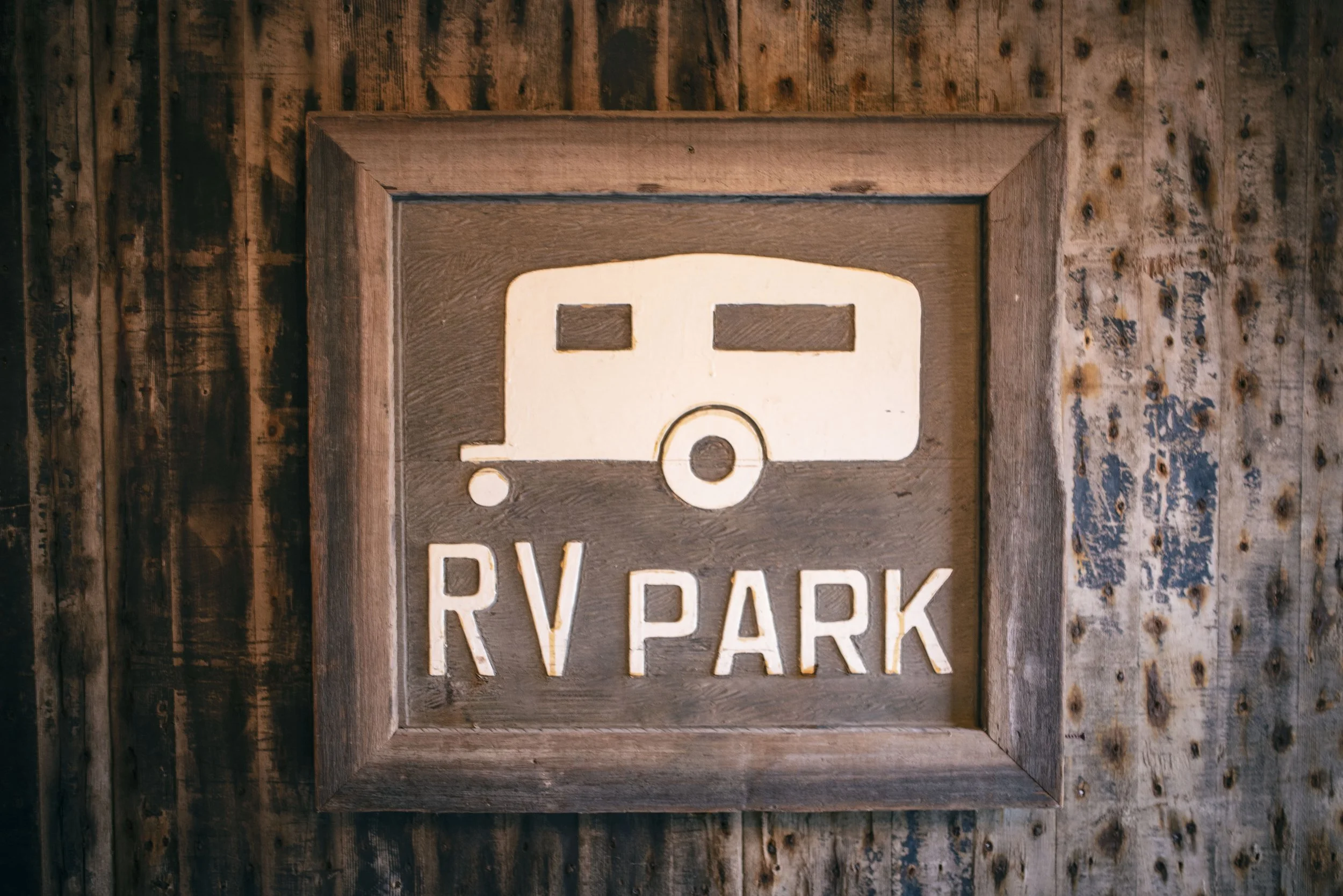 Hand carved wood RV park sign