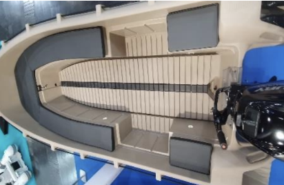 A small boat with a central console and seating, equipped with an outboard motor, docked at a marina or dock.