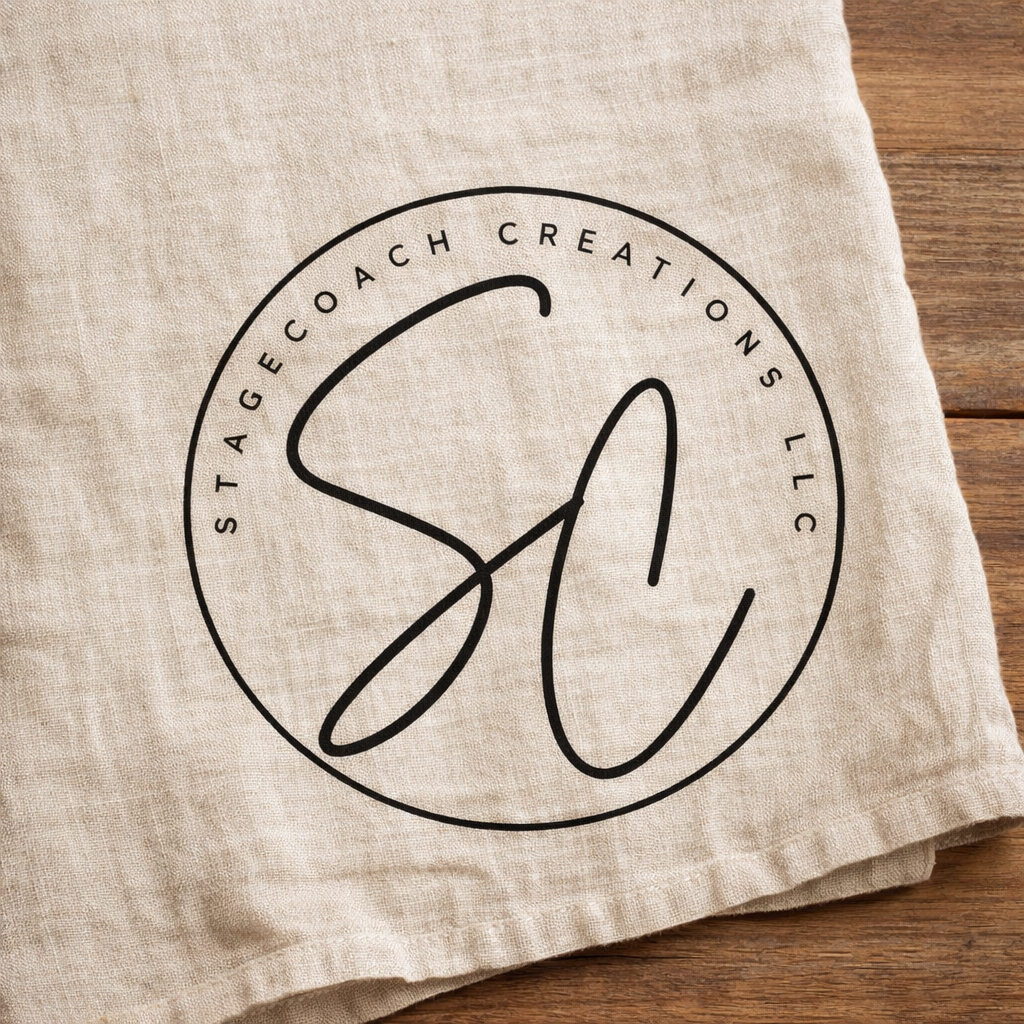 Stagecoach Creations LLC circular logo with black scripted “SC” initials centered inside a thin black ring on a neutral background.