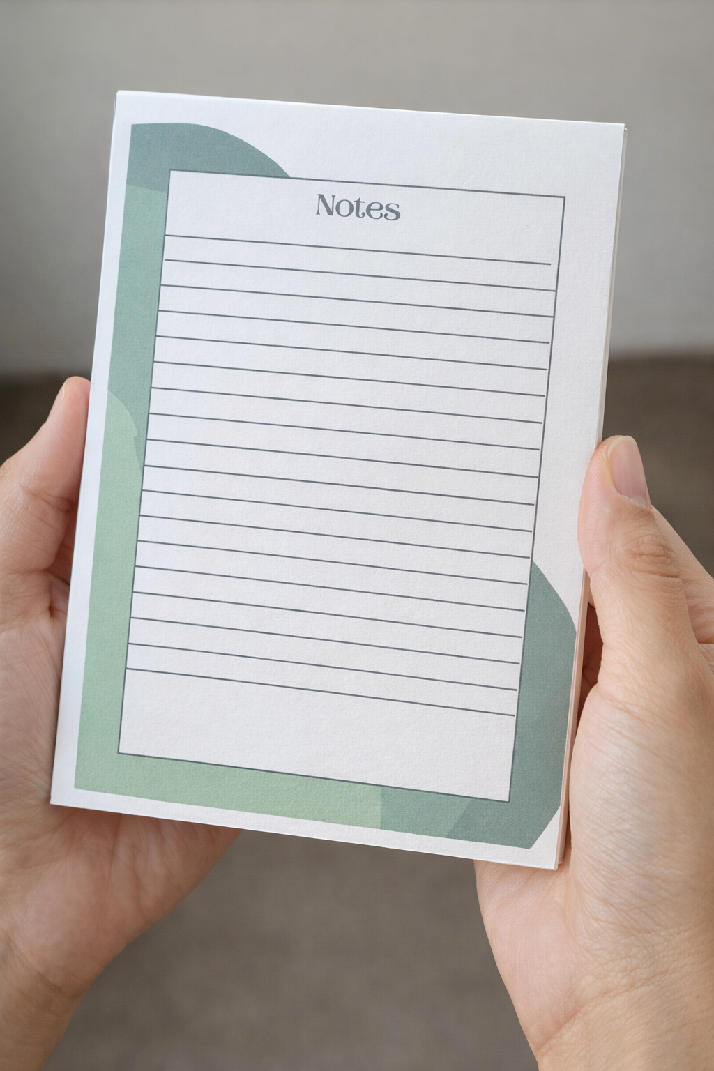 Hands holding a 5x7 lined notepad with green accents and “Notes” header, minimalist faith-inspired design.