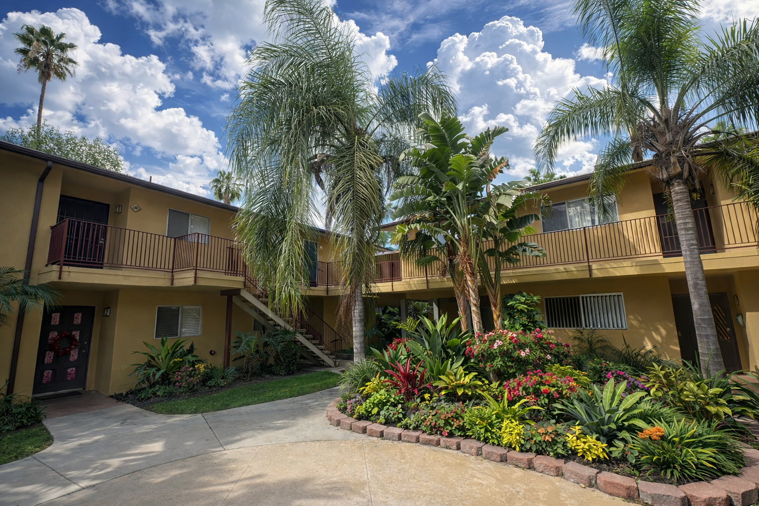 Interior Courtyard at Palm Vista Surrounded by Lush Tropical Greenery