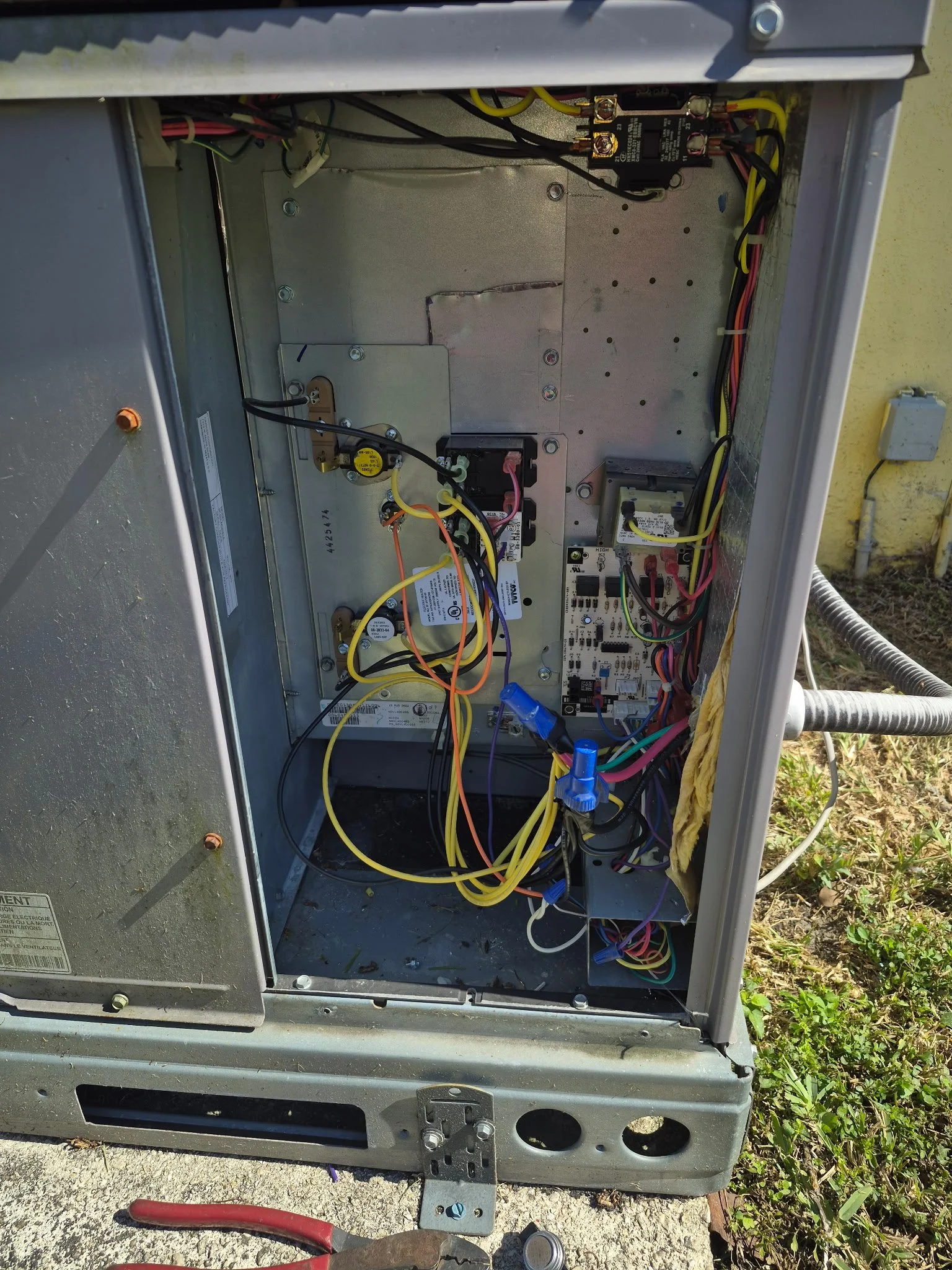 Finishing touches on installed AC.