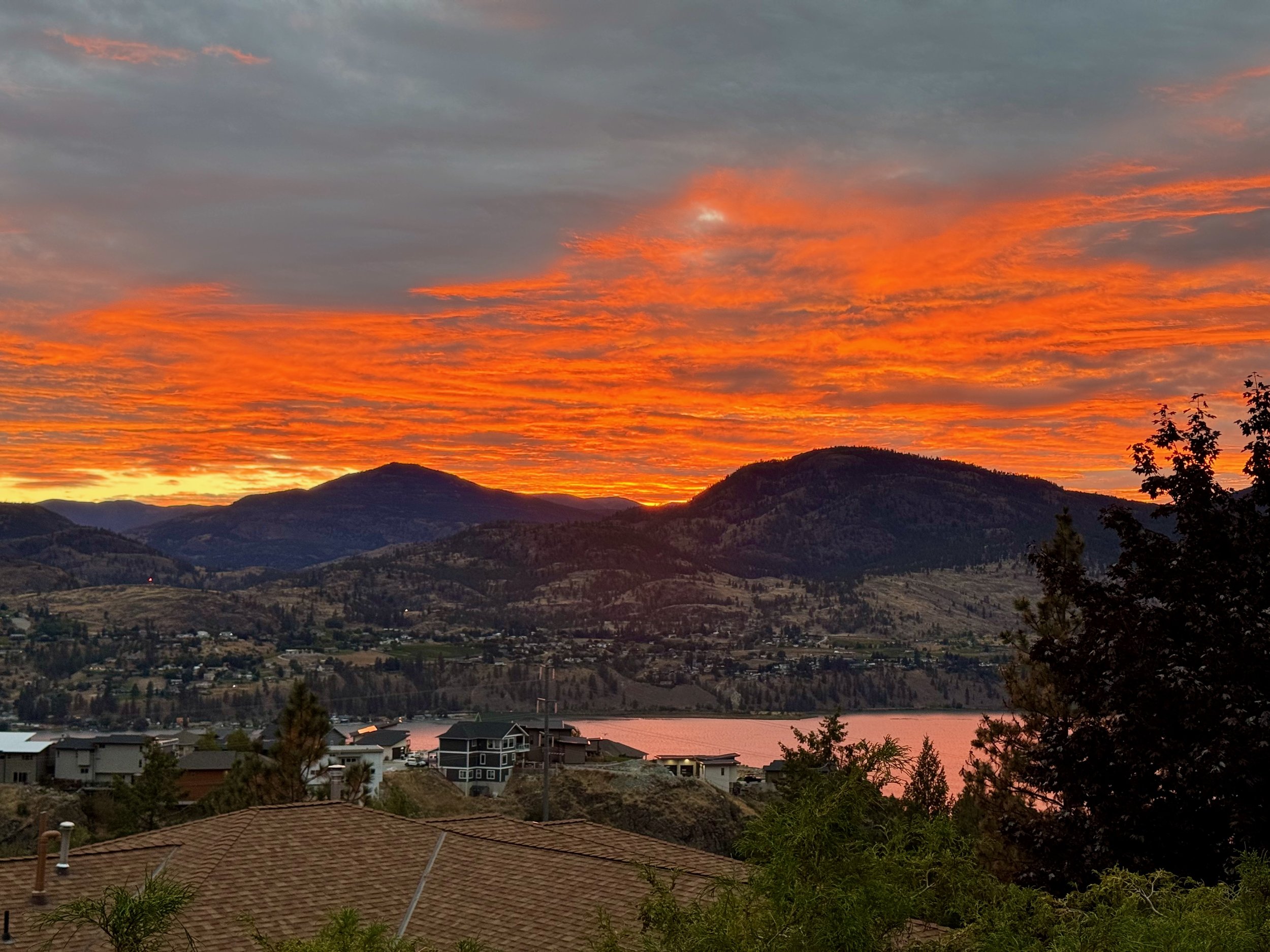 A spectacular summer sunset lights the sky above Skaha Lake in British Columbia’s Okanagan Valley.