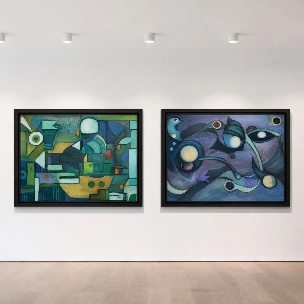 Two abstract paintings in black frames hanging on a white wall in an art gallery.