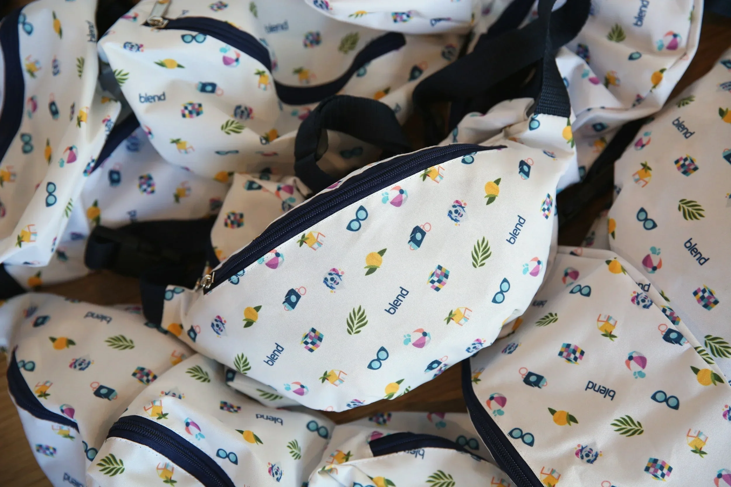 Custom-designed Blend fanny packs for Grace Hopper Celebration in Orlando, FL. // I designed the print with one of my favorite designers, featuring our founders' dog and cute Florida-themed essentials. They were a hit.