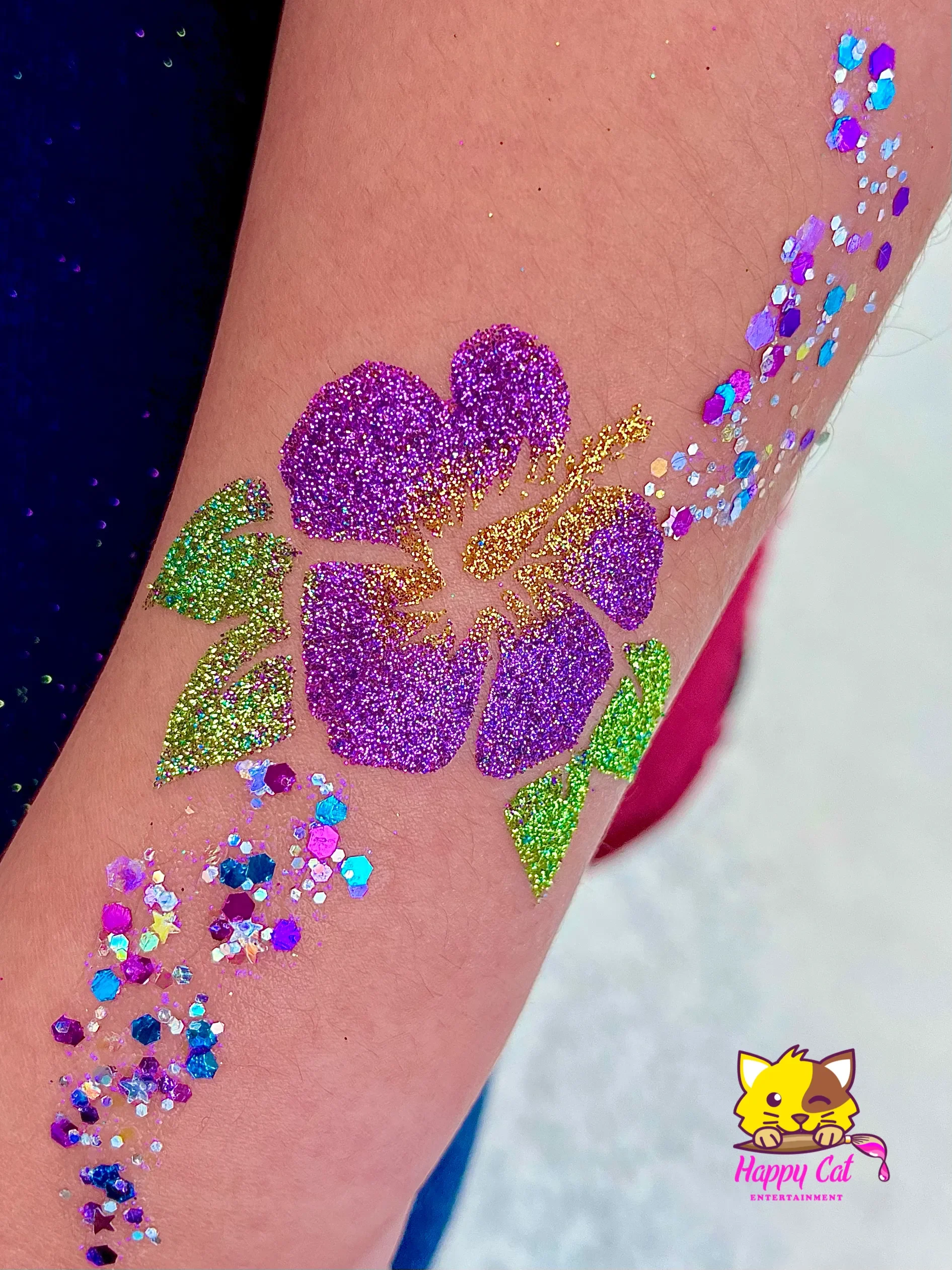 Hawaiian flower glitter tattoo with rainbow sparkle by Happy Cat Entertainment in Temecula, CA.