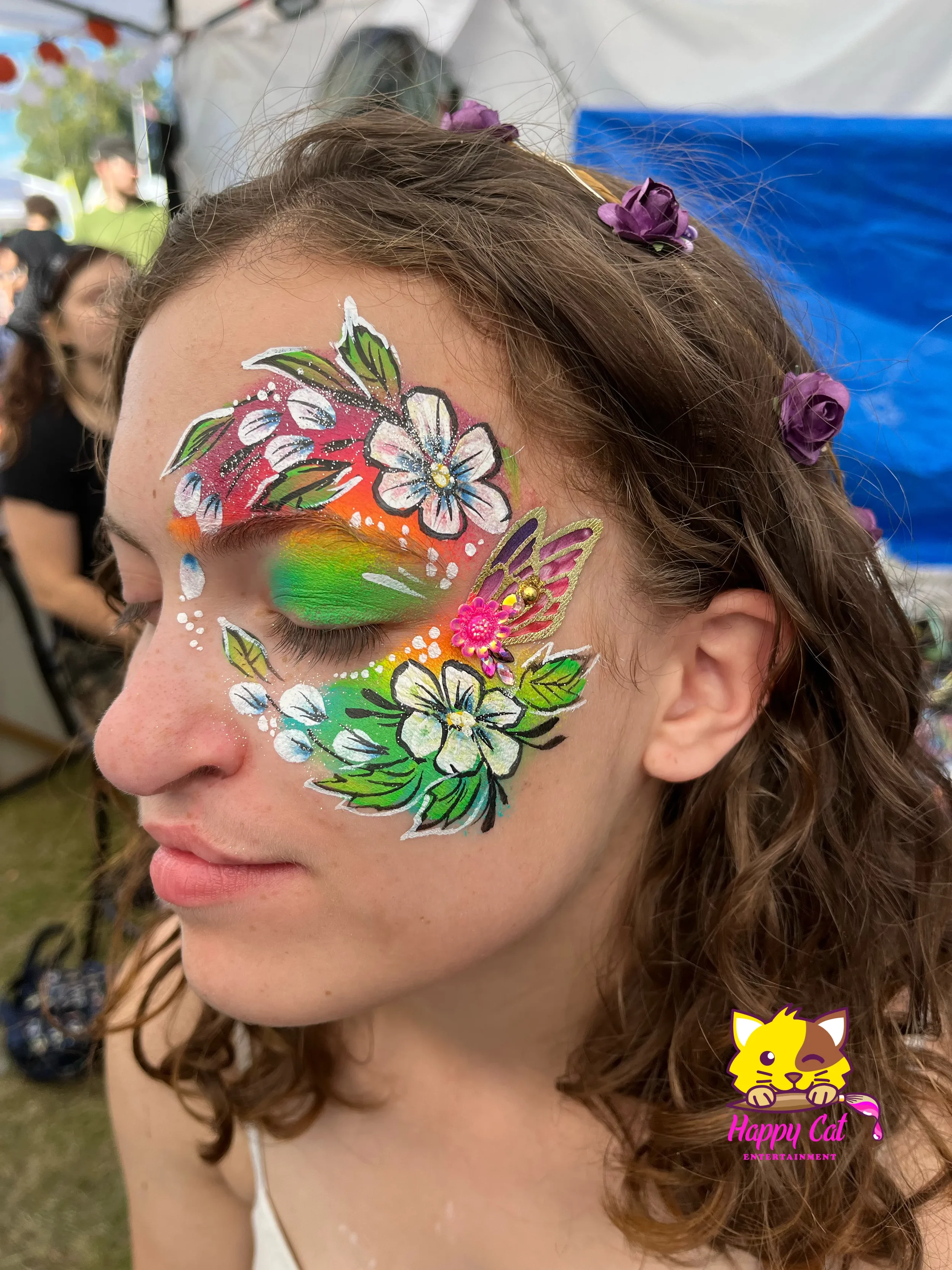 Girl wearing butterfly face paint by Happy Cat Entertainment in Temecula, California.